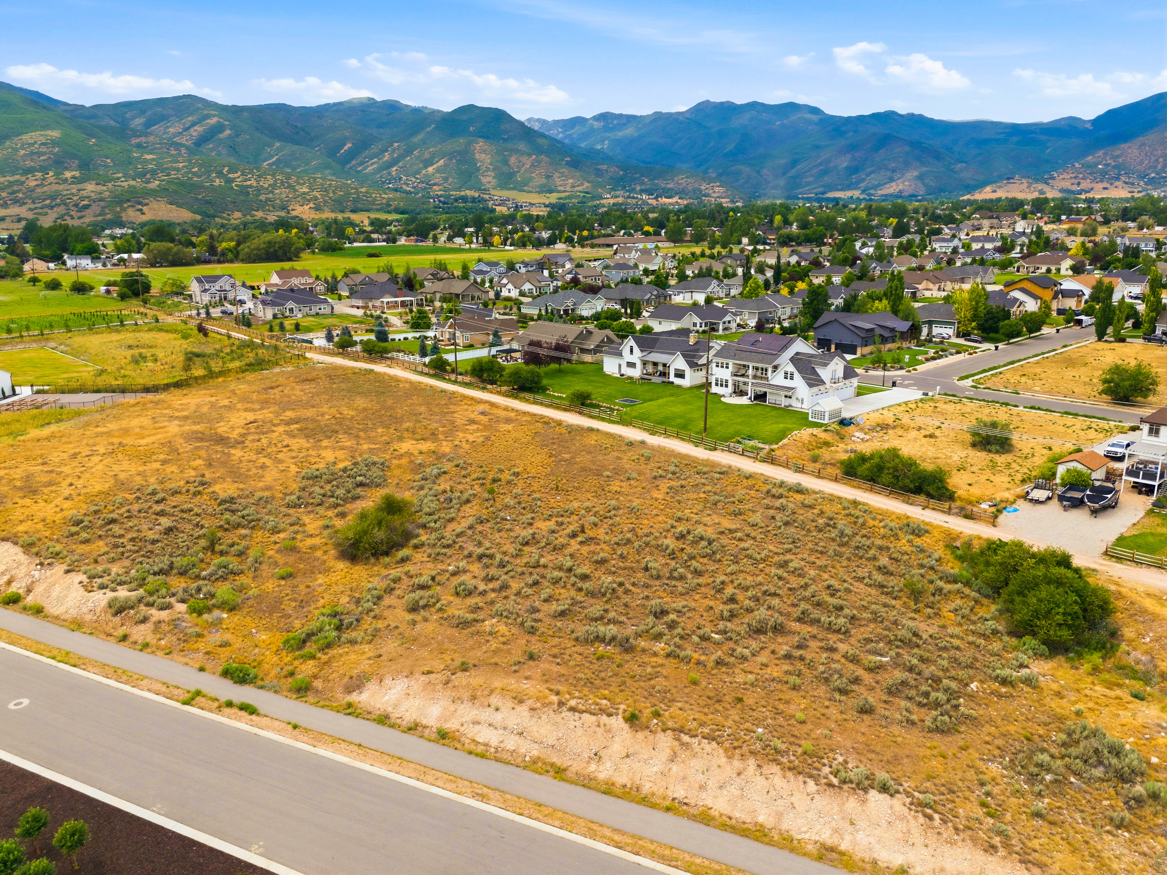 Expansive undeveloped parcel featuring natural terrain and distant mountain range