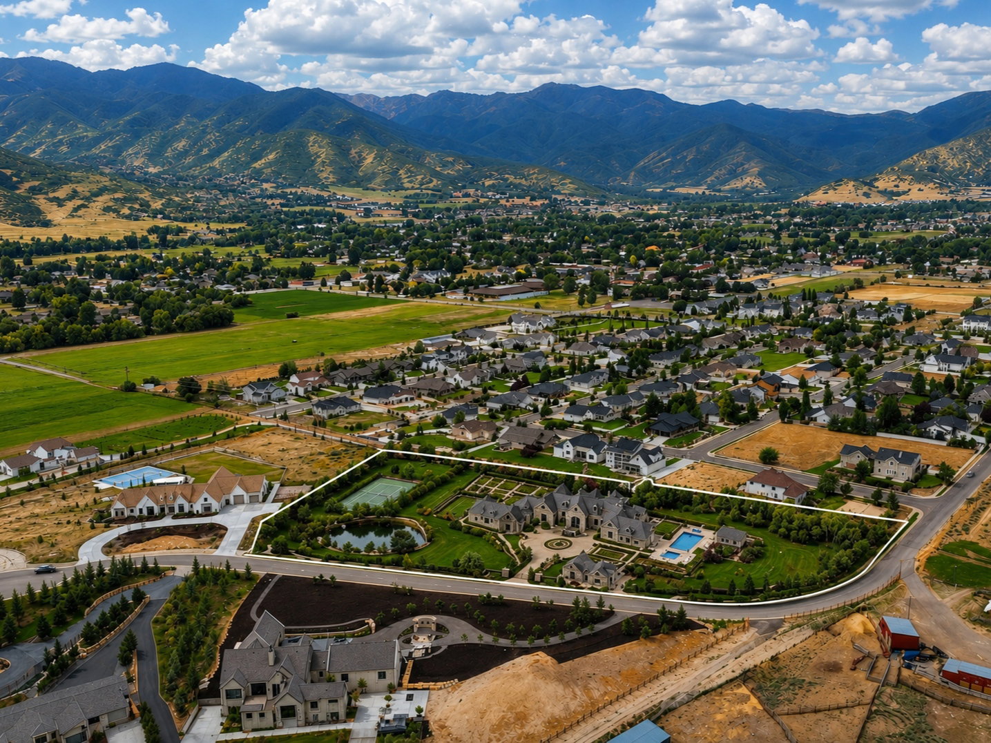 Expansive property featuring a grand residence, private pond, swimming pool, and tennis court