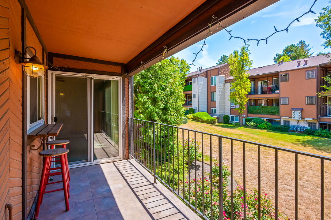 Private balcony featuring tiled flooring and a metal railing