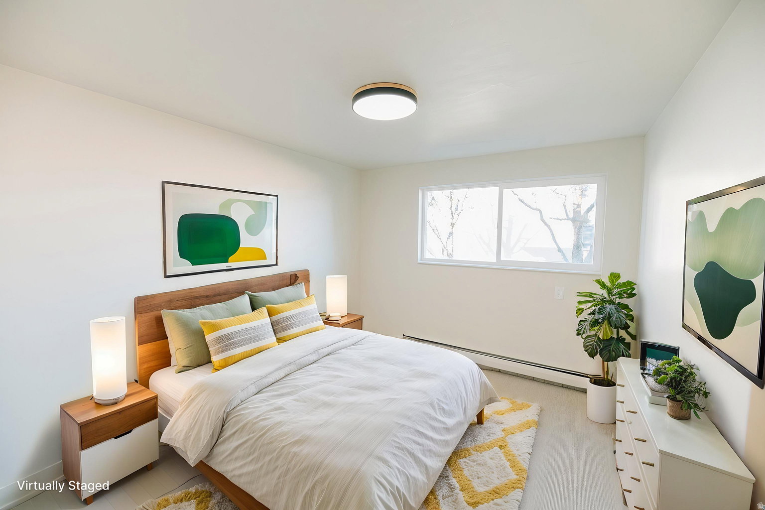Bedroom featuring light-toned walls, a rectangular window, a ceiling-mounted light fixture, and light wood-finish flooring
