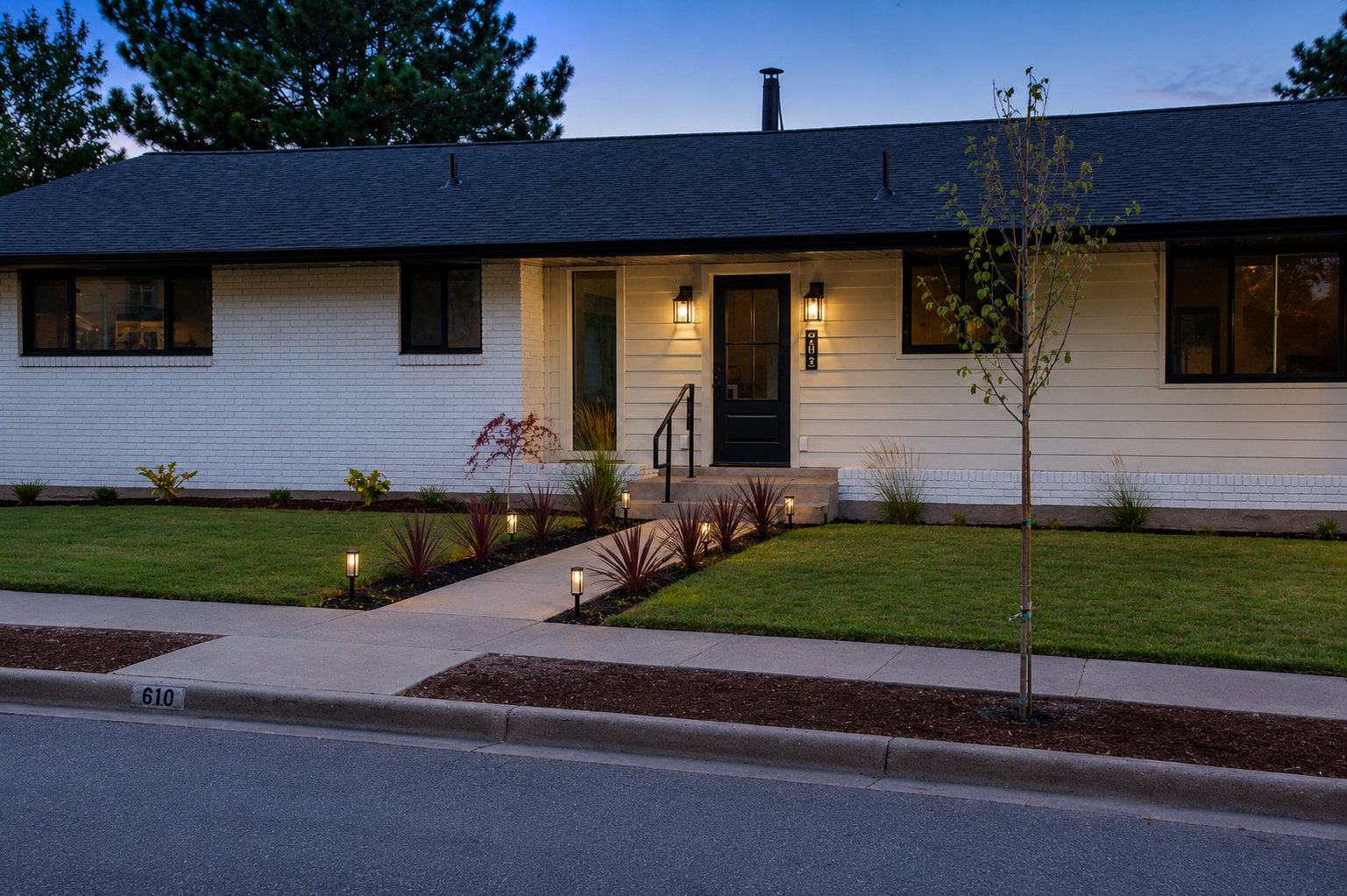 Contemporary ranch exterior featuring white brick and horizontal siding