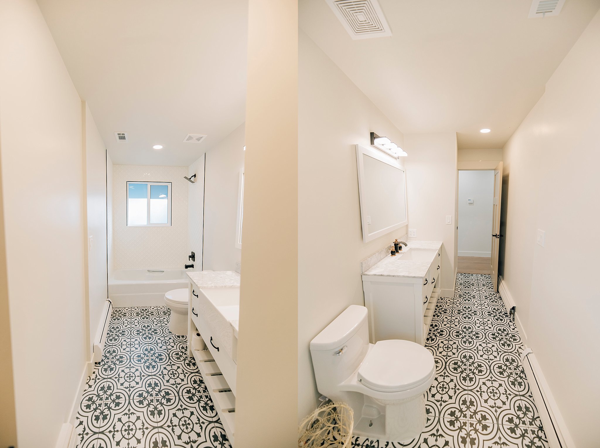 Bathroom featuring decorative black and white tile flooring, white vanity with dual sinks, white bathtub with a window, and matte black fixtures