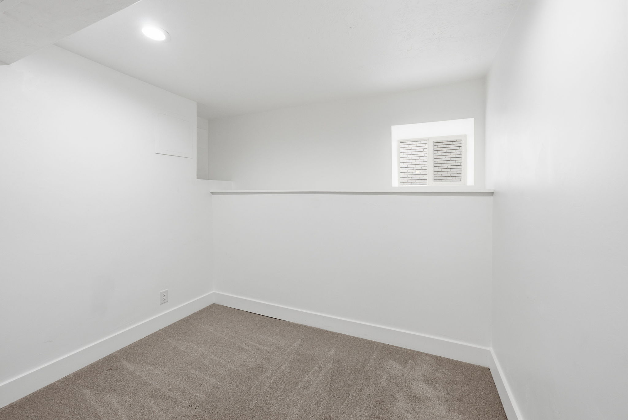 Recessed lighting, painted walls, carpet flooring, baseboard trim, and a window with white blinds