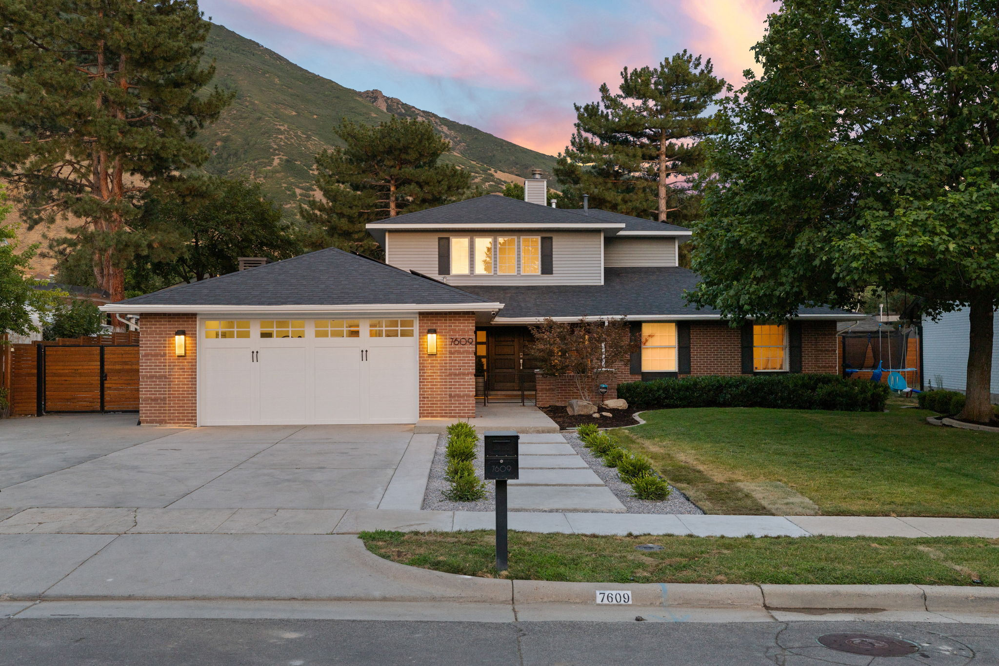 Brick and siding exterior residence with an attached two-car garage