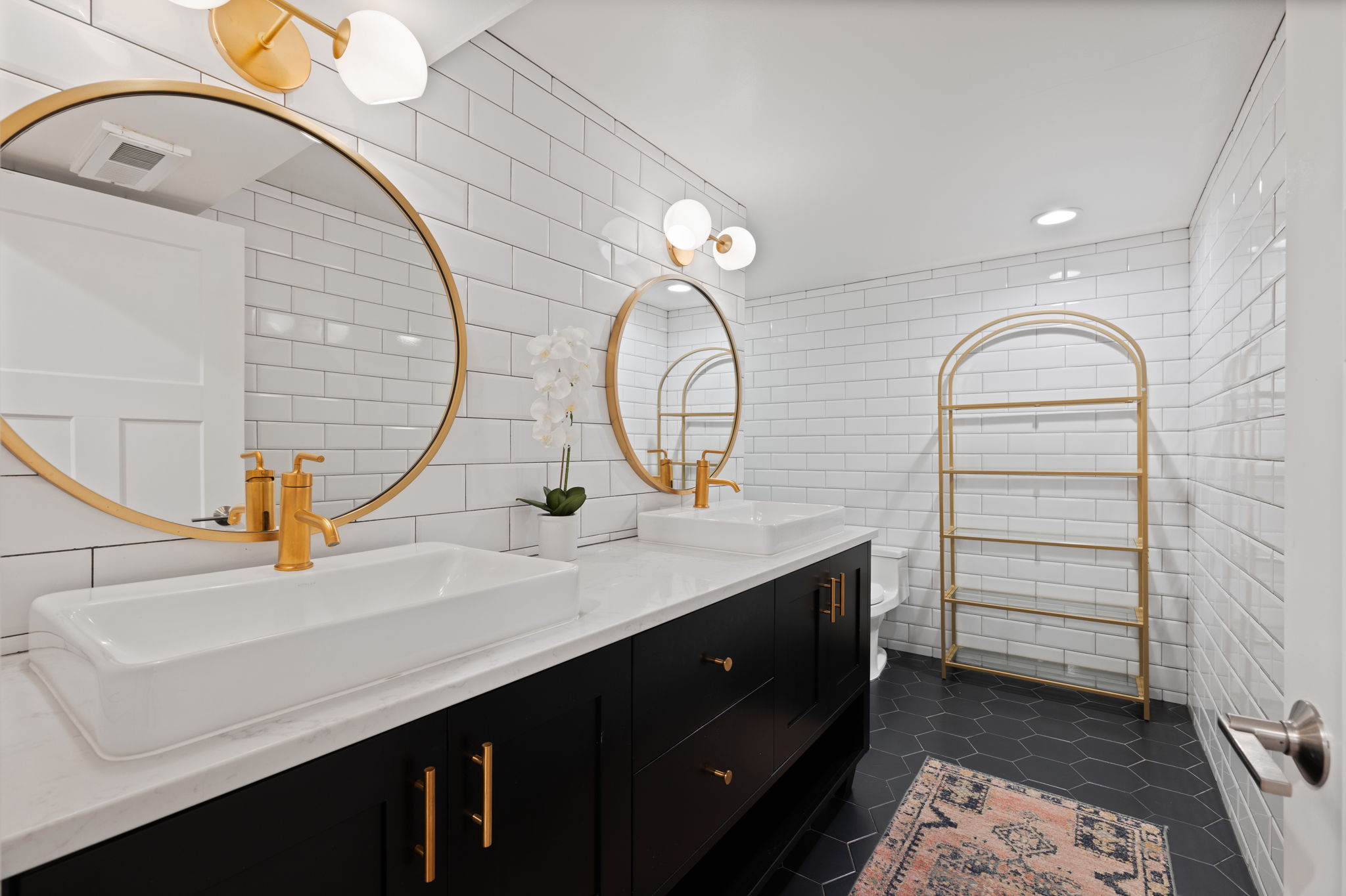 Dual vanity with quartz countertop, rectangular vessel sinks, and gold-finish fixtures
