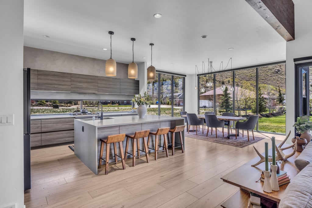 Open-concept living space with light wood-finish flooring