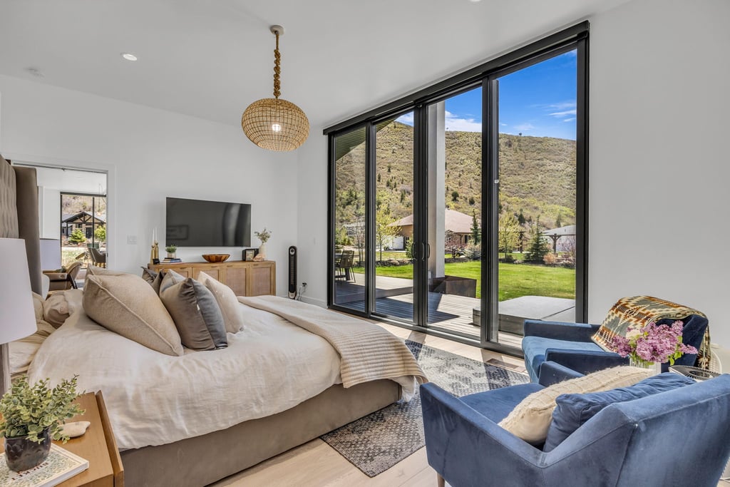 Expansive sliding glass doors provide abundant natural light and direct outdoor access