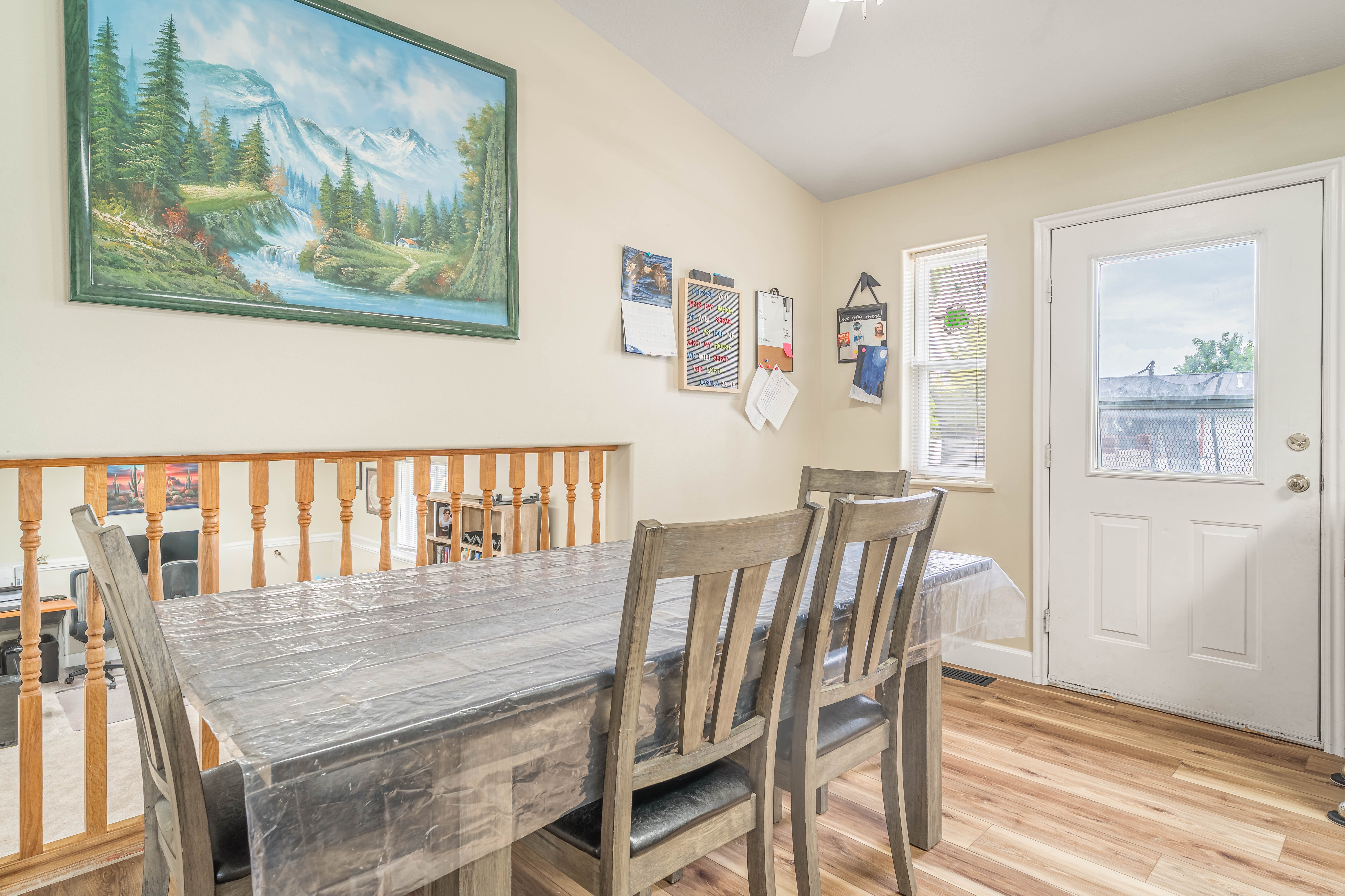 Dining area featuring wood-finish flooring and neutral wall tones