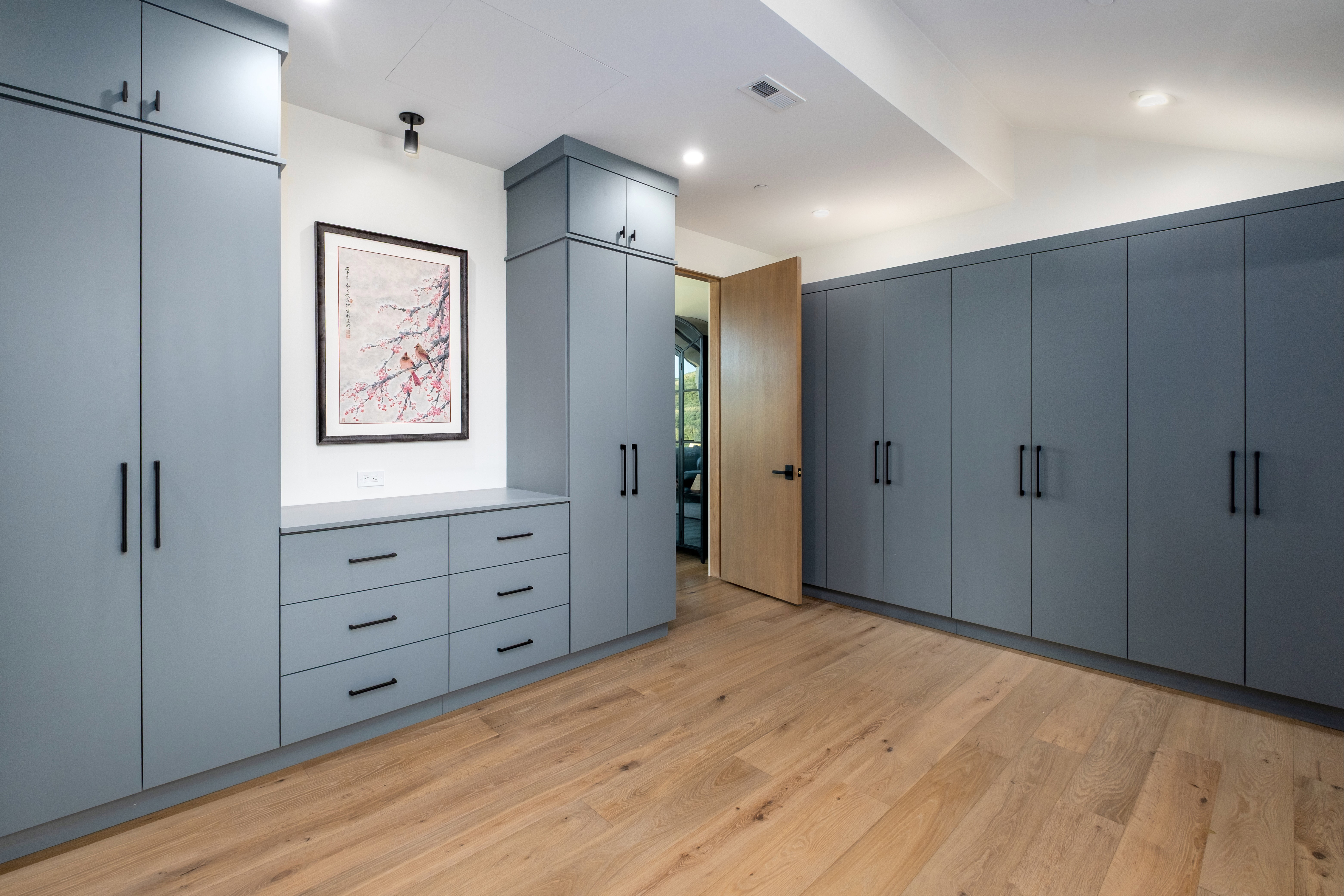 Custom built-in cabinetry in a muted blue finish