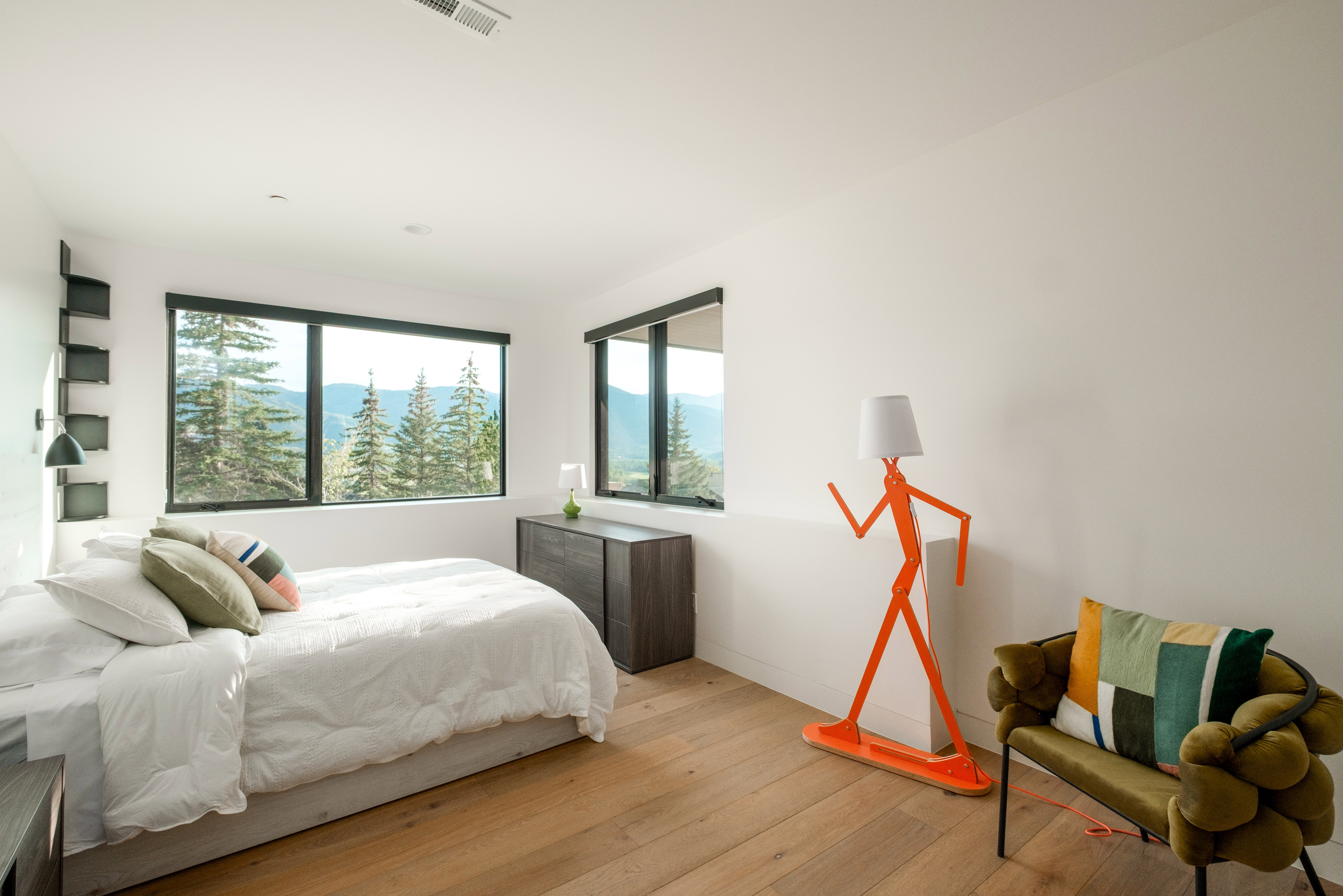 Bright interior space featuring wood-finish flooring and expansive windows