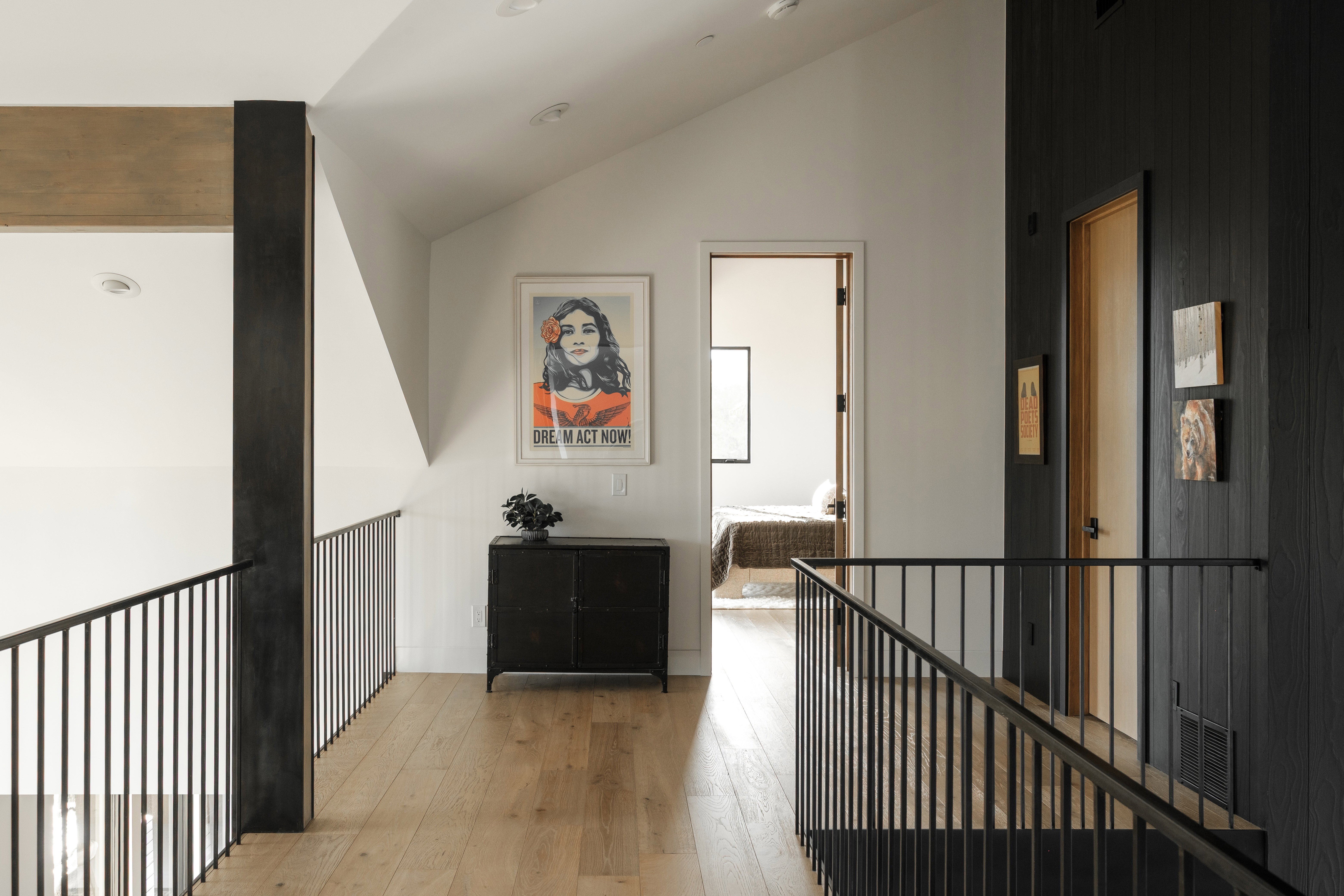Open hallway with light wood-finish flooring