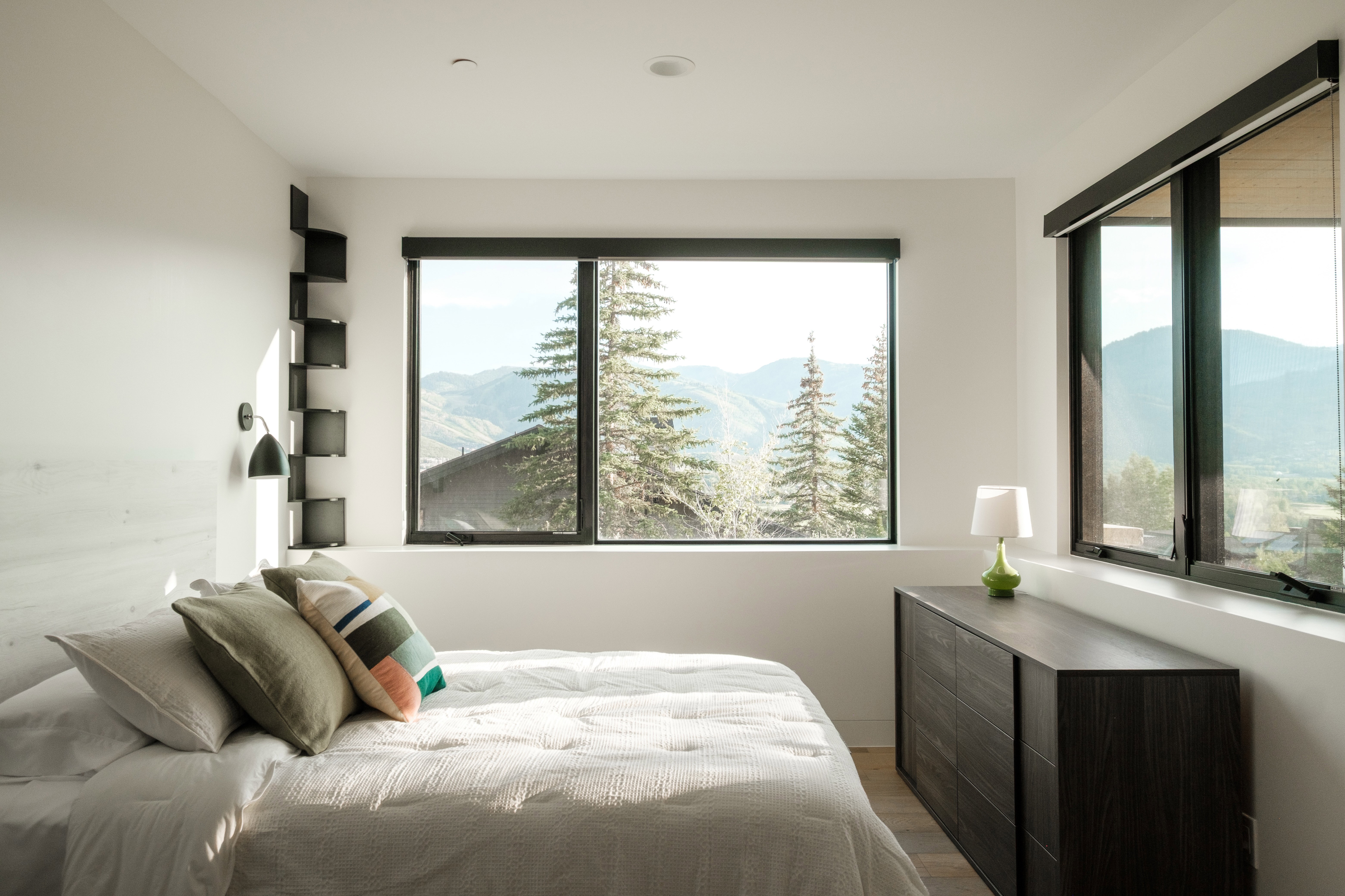 Expansive windows frame mountain scenery