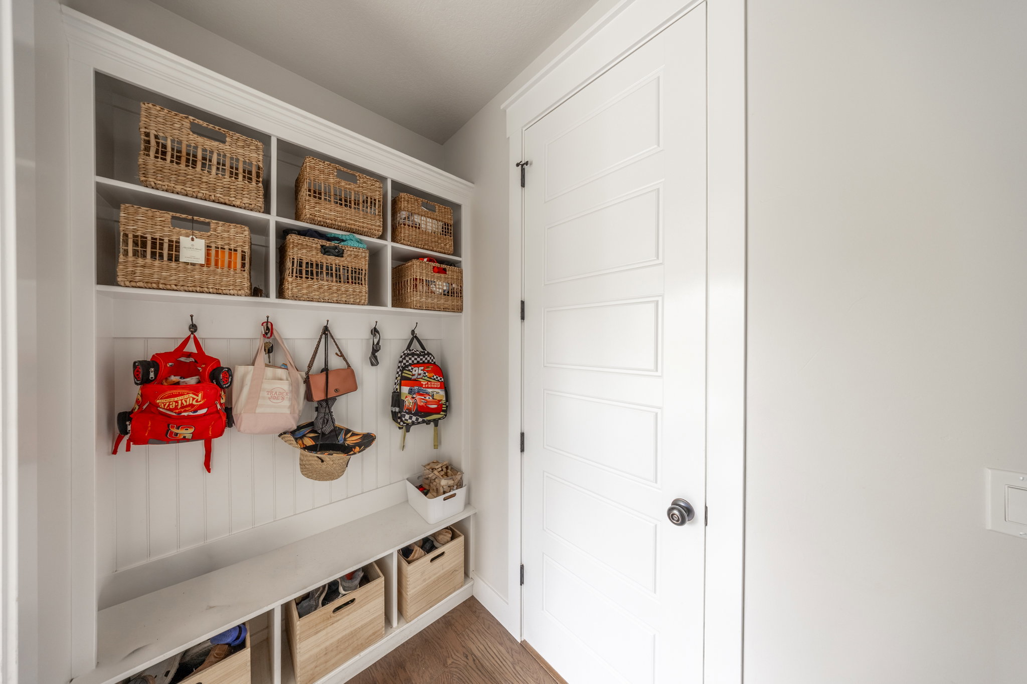 Built-in mudroom bench with beadboard backing