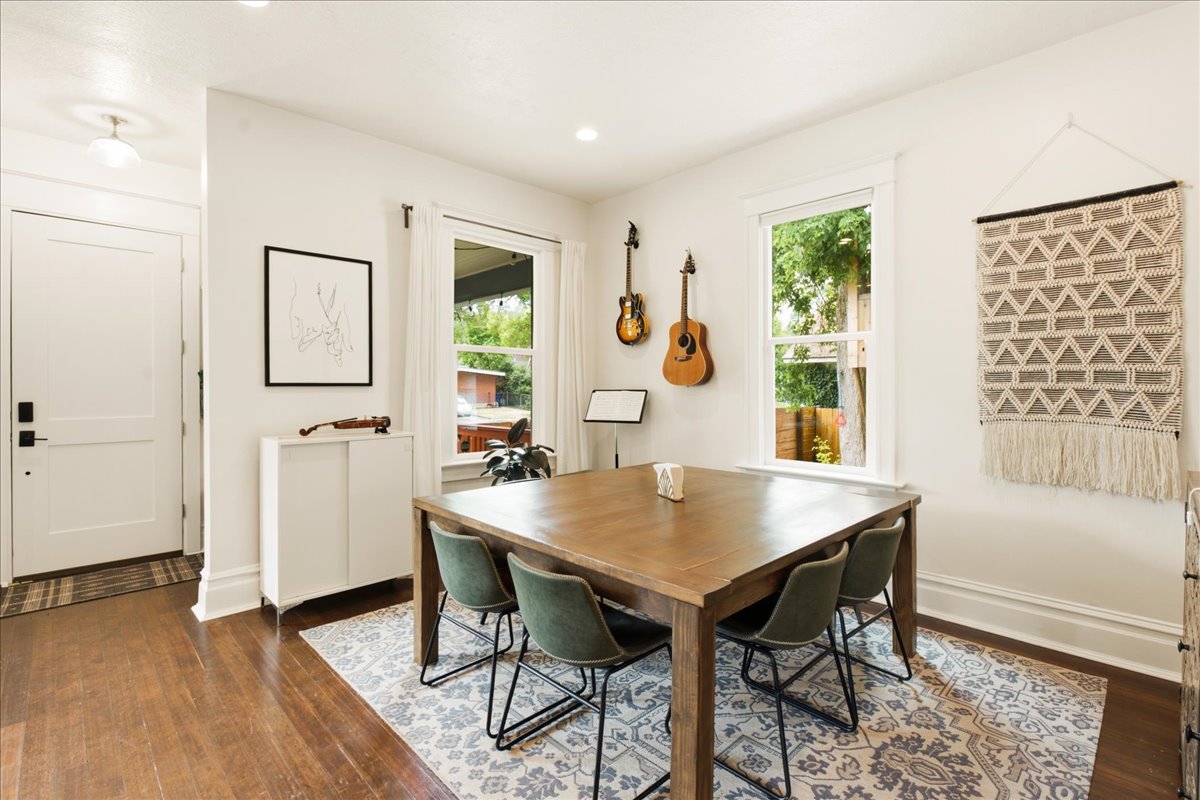 Hardwood flooring extending from the entry into the dining area
