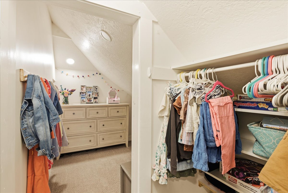 Built-in closet system with shelving and hanging rods