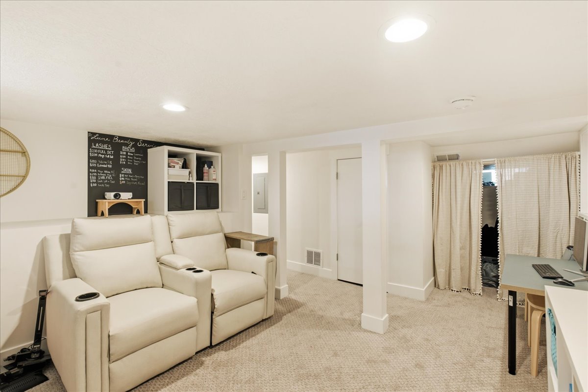 Carpeted lower level room featuring recessed lighting and white painted walls
