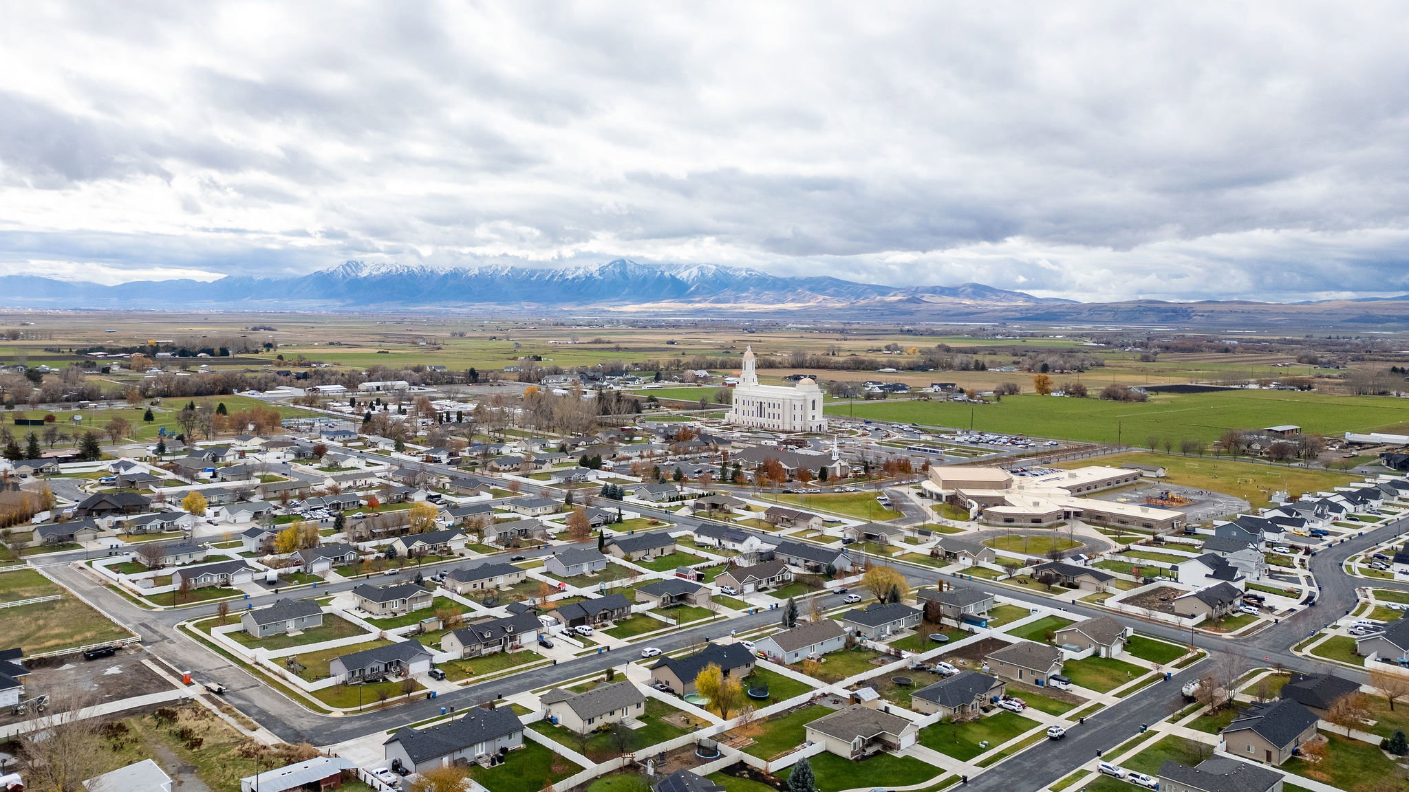 Aerial perspective showcasing a residential neighborhood with single-family homes and established streets