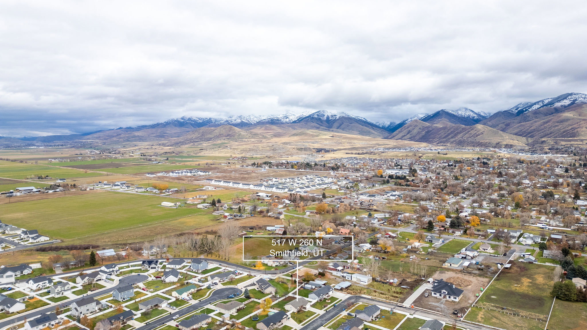 Expansive aerial perspective showcasing a developed residential area with numerous single-family homes