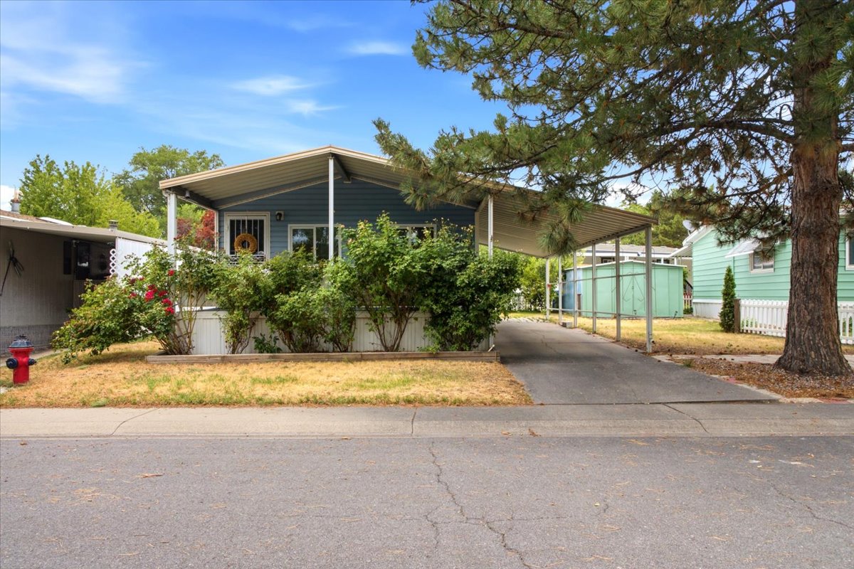 Light blue siding exterior with a covered porch