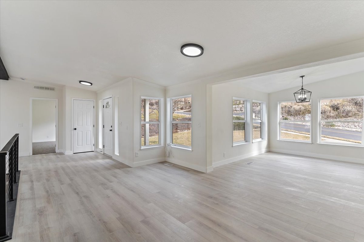 Spacious interior featuring light wood-finish flooring throughout