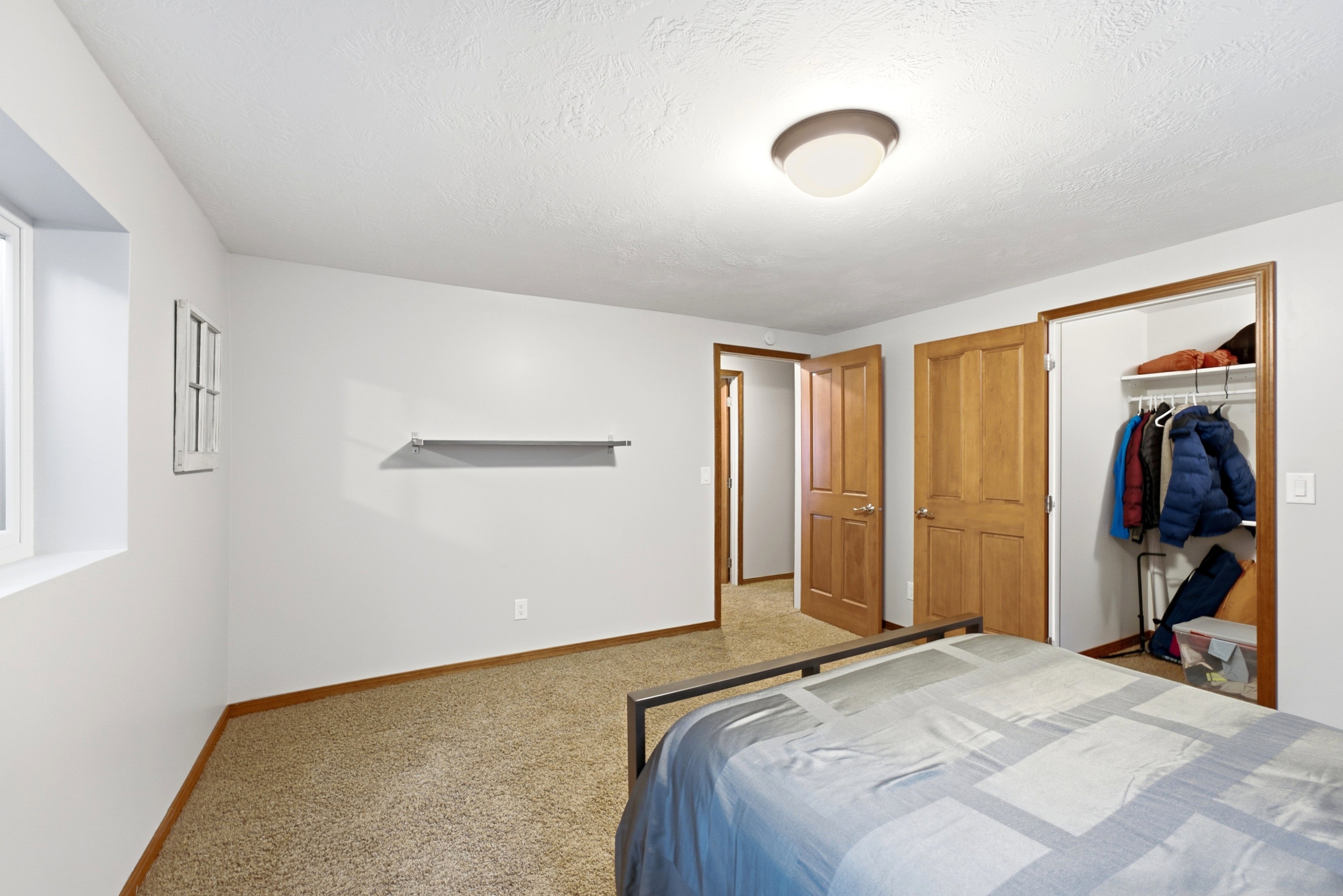 Large bedroom with large walk in closet.