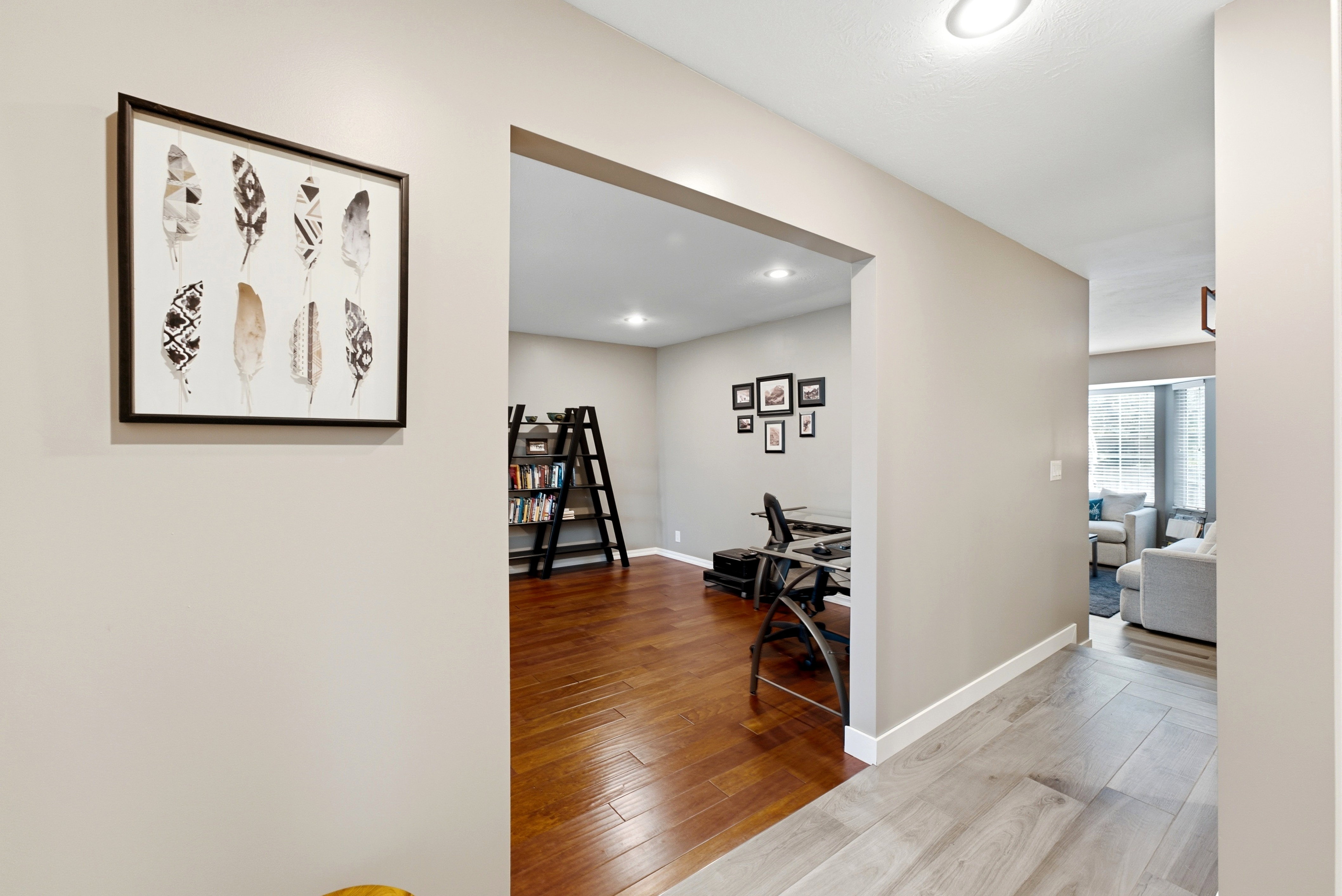Entry and hallway featuring wood-finish flooring and neutral wall tones.