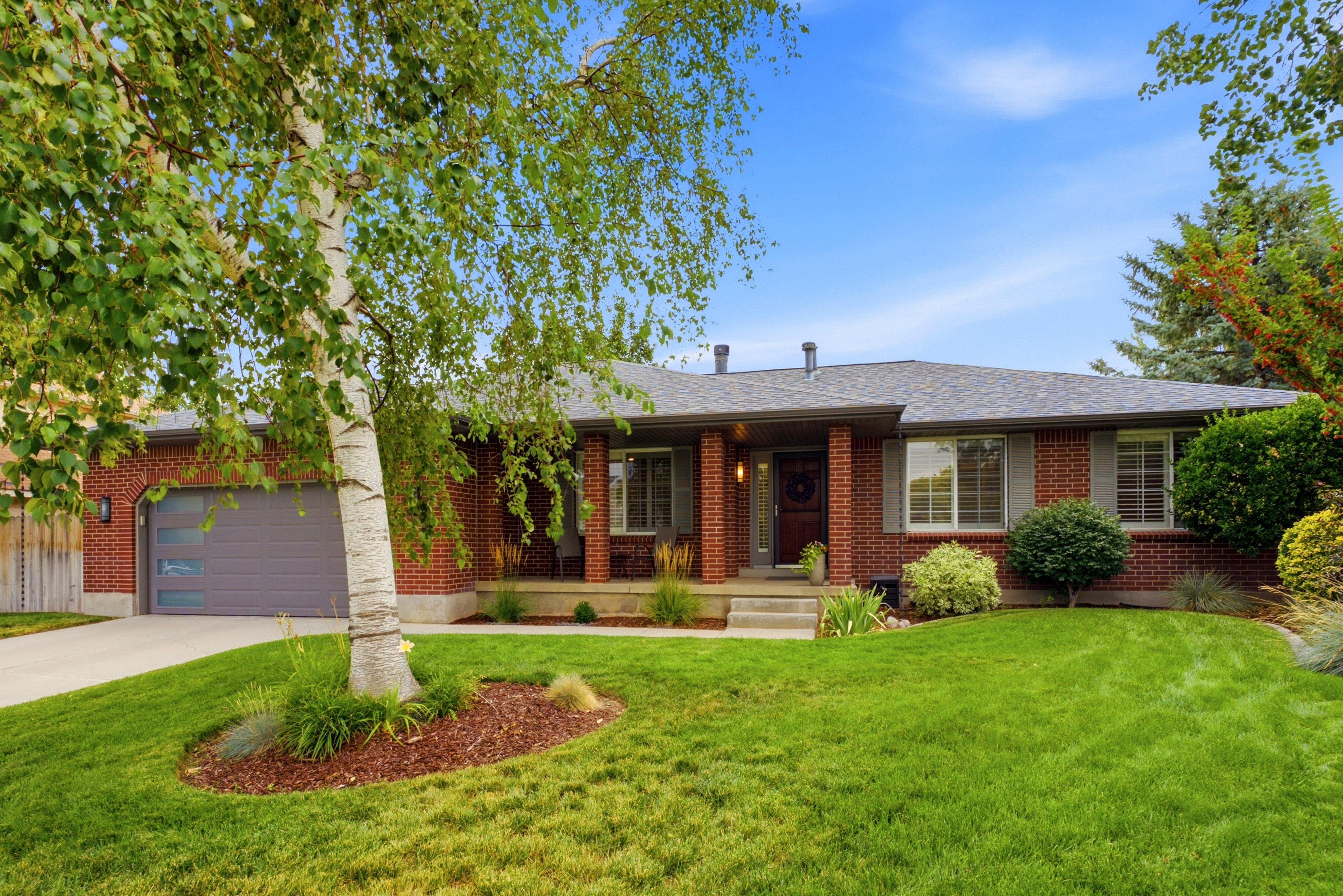 Beautiful  brick exterior with a covered porch in East Sandy.