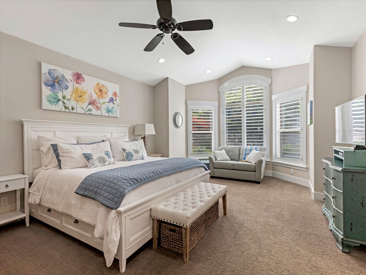 Spacious room featuring a vaulted ceiling with recessed lighting and a ceiling fan