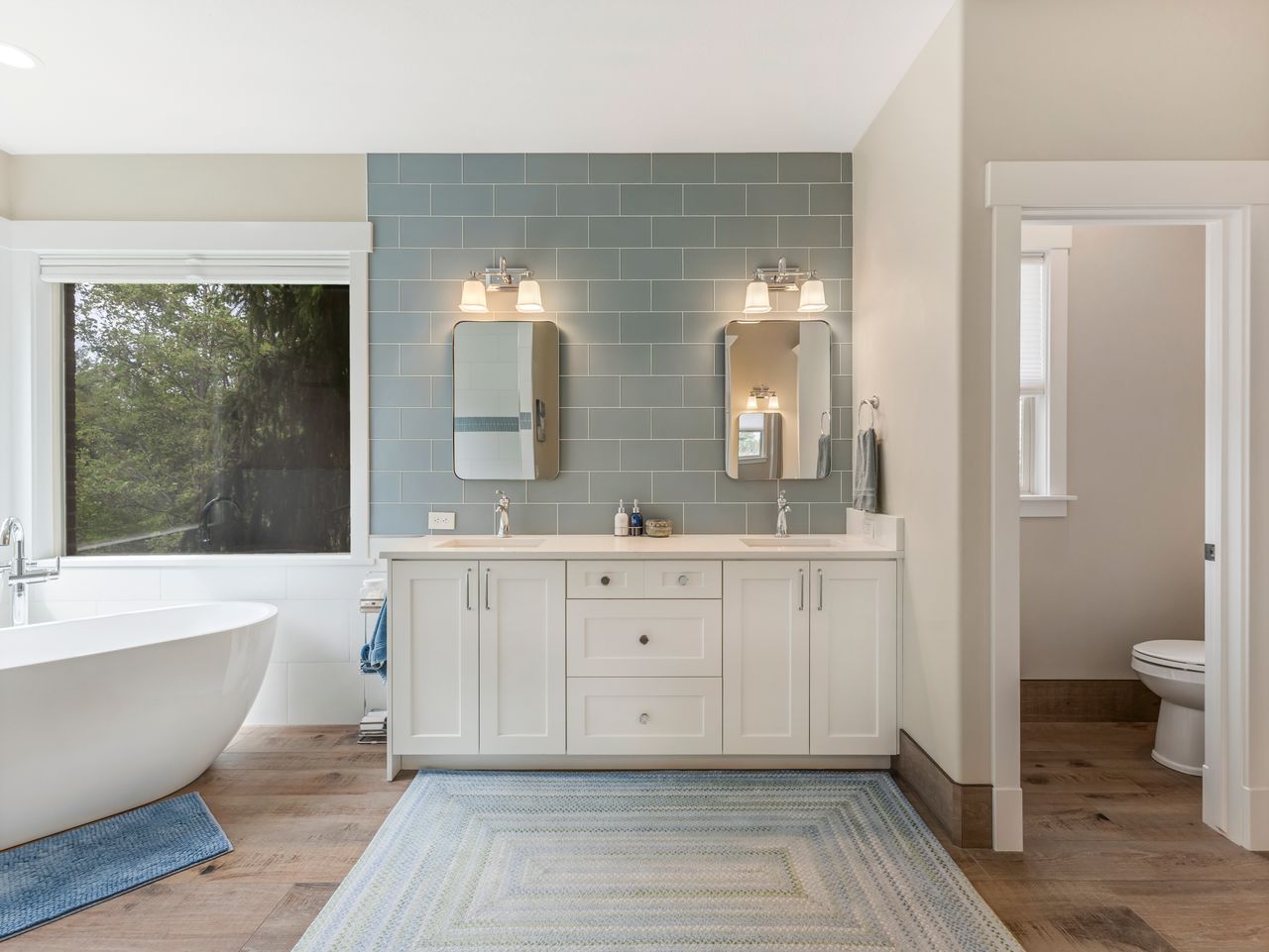 Freestanding soaking tub with a large window