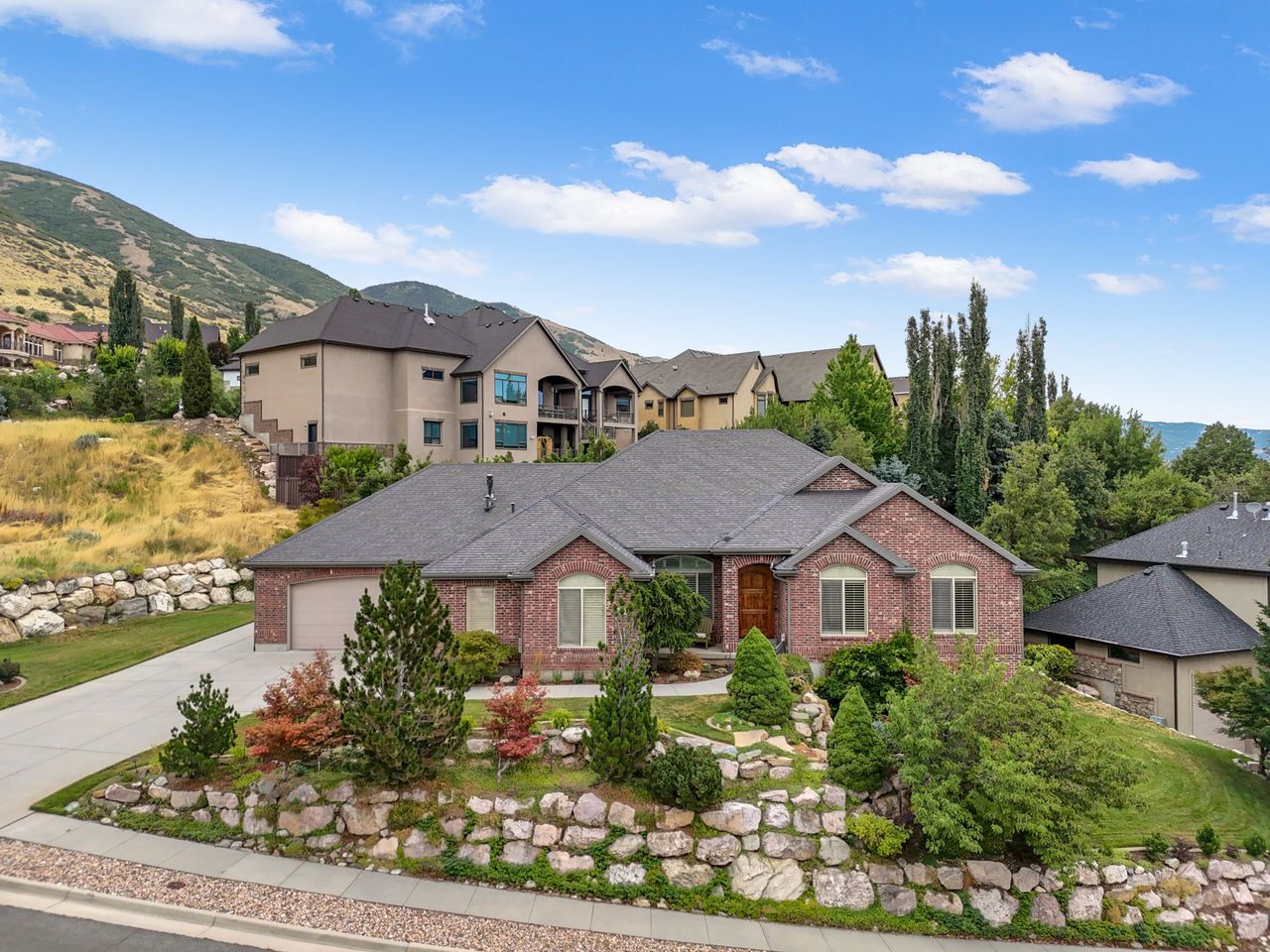Brick exterior with dark gray roofing