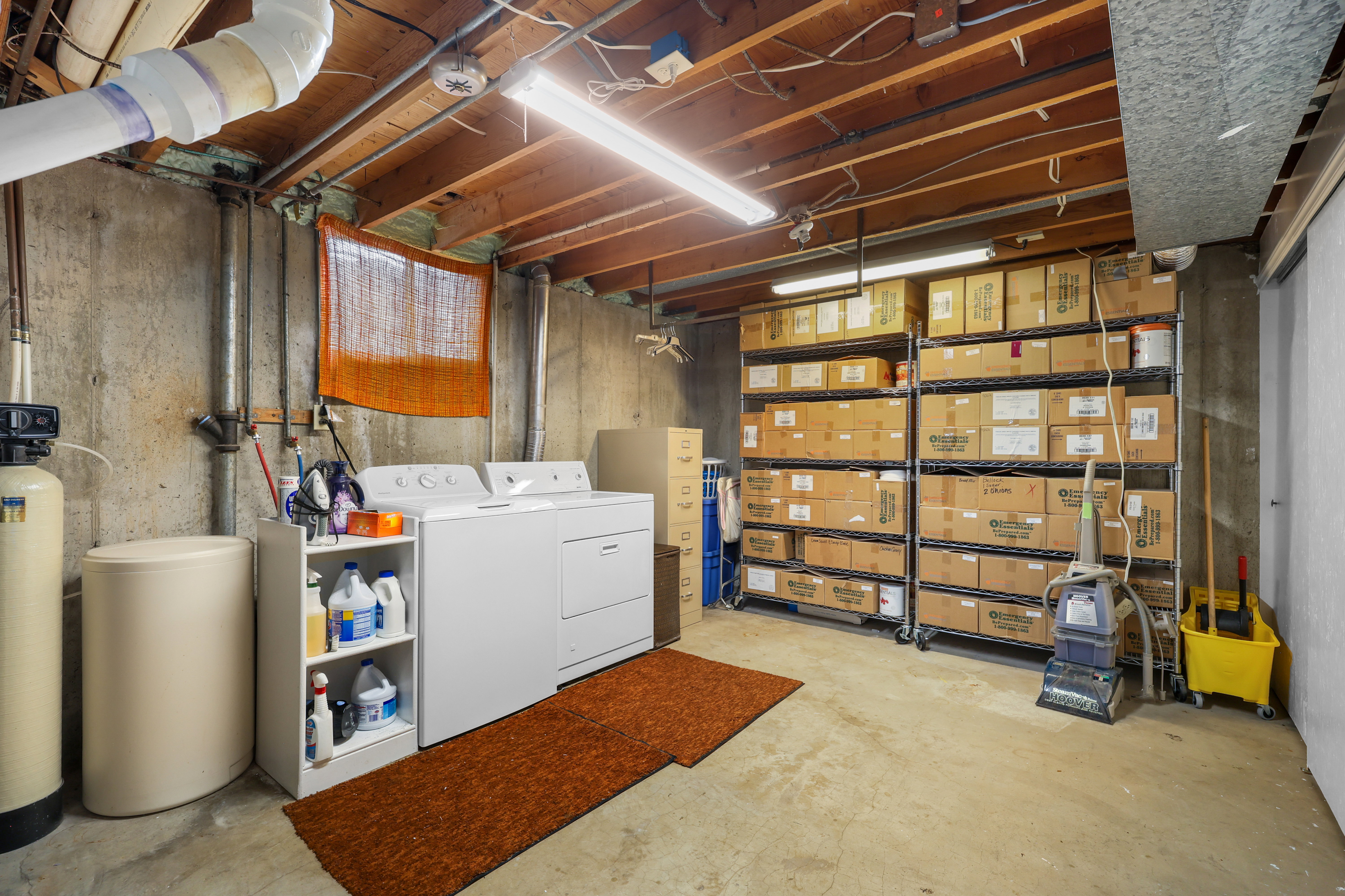 Concrete foundation walls supporting exposed wood ceiling joists