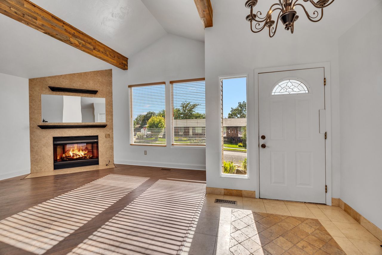 Vaulted ceilings with exposed wood beams highlight this living space