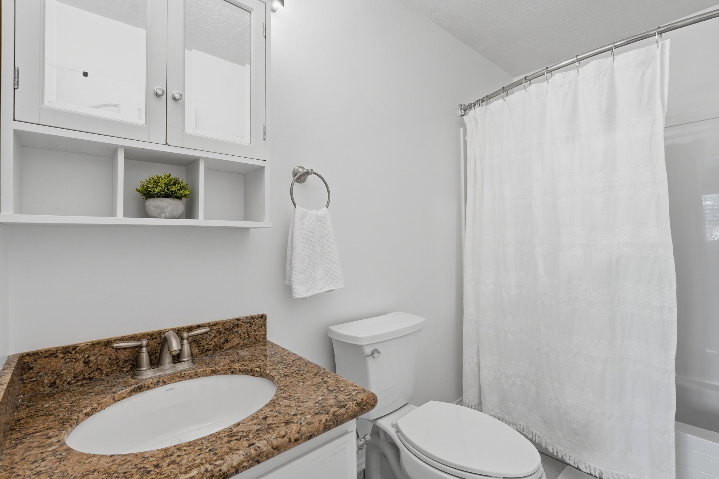 Bathroom with white walls and a white ceiling