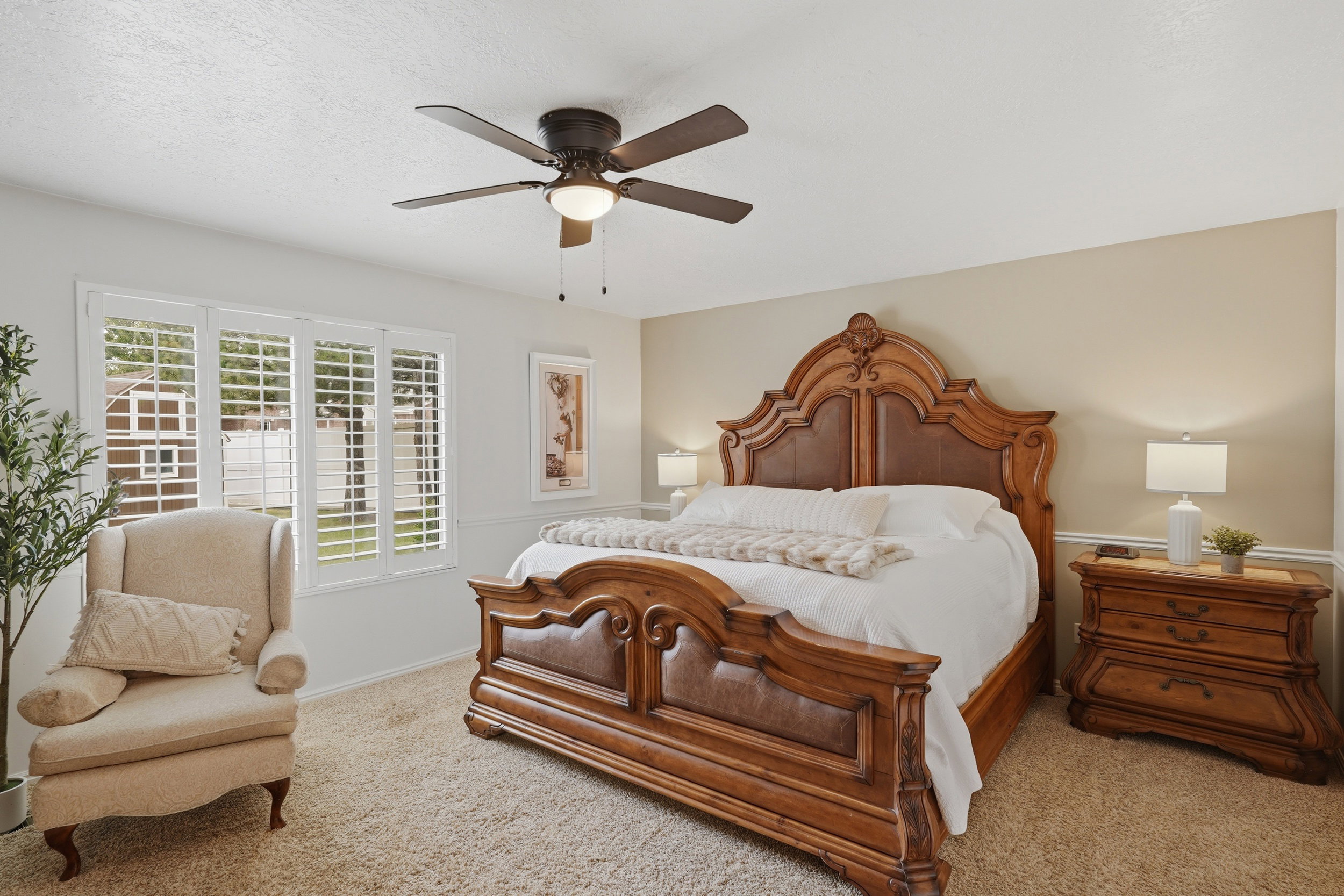 Bedroom featuring neutral-toned walls and plush carpet flooring