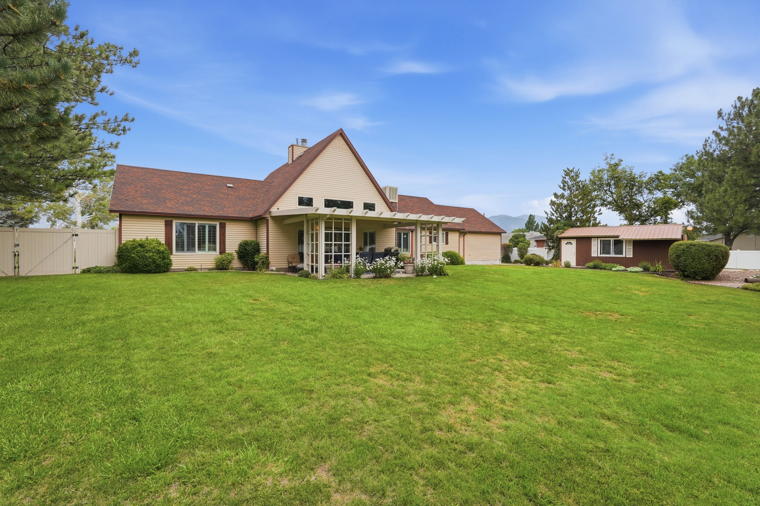 Spacious rear yard with expansive lawn
