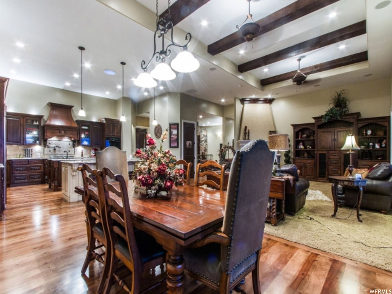 Open-concept living space featuring wood-finish flooring throughout