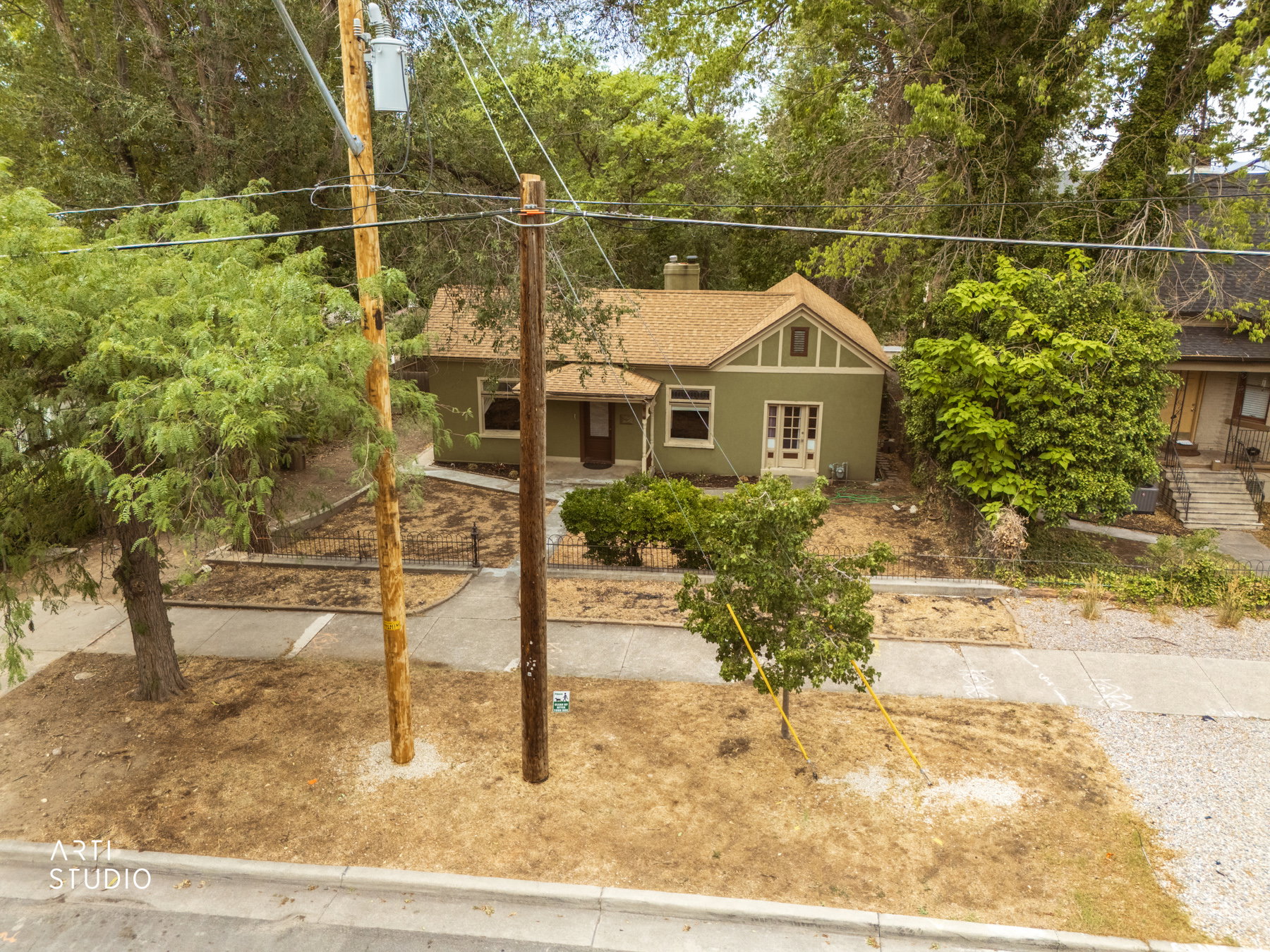 Single-story residence featuring a gabled roofline and a stucco exterior finish