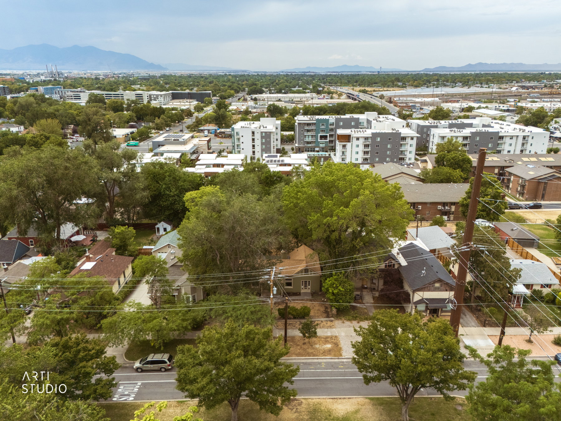 Aerial perspective showcasing a residential neighborhood with surrounding urban development
