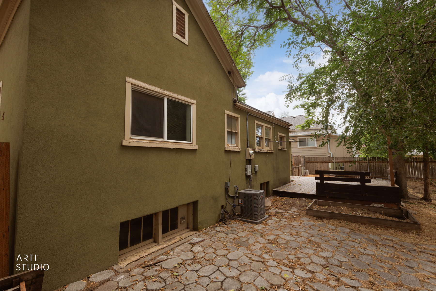 Rear exterior with textured stucco siding