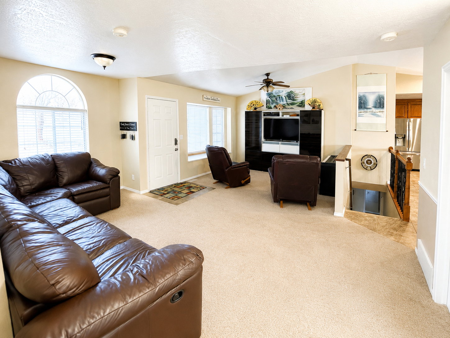 Open concept living area with vaulted ceilings