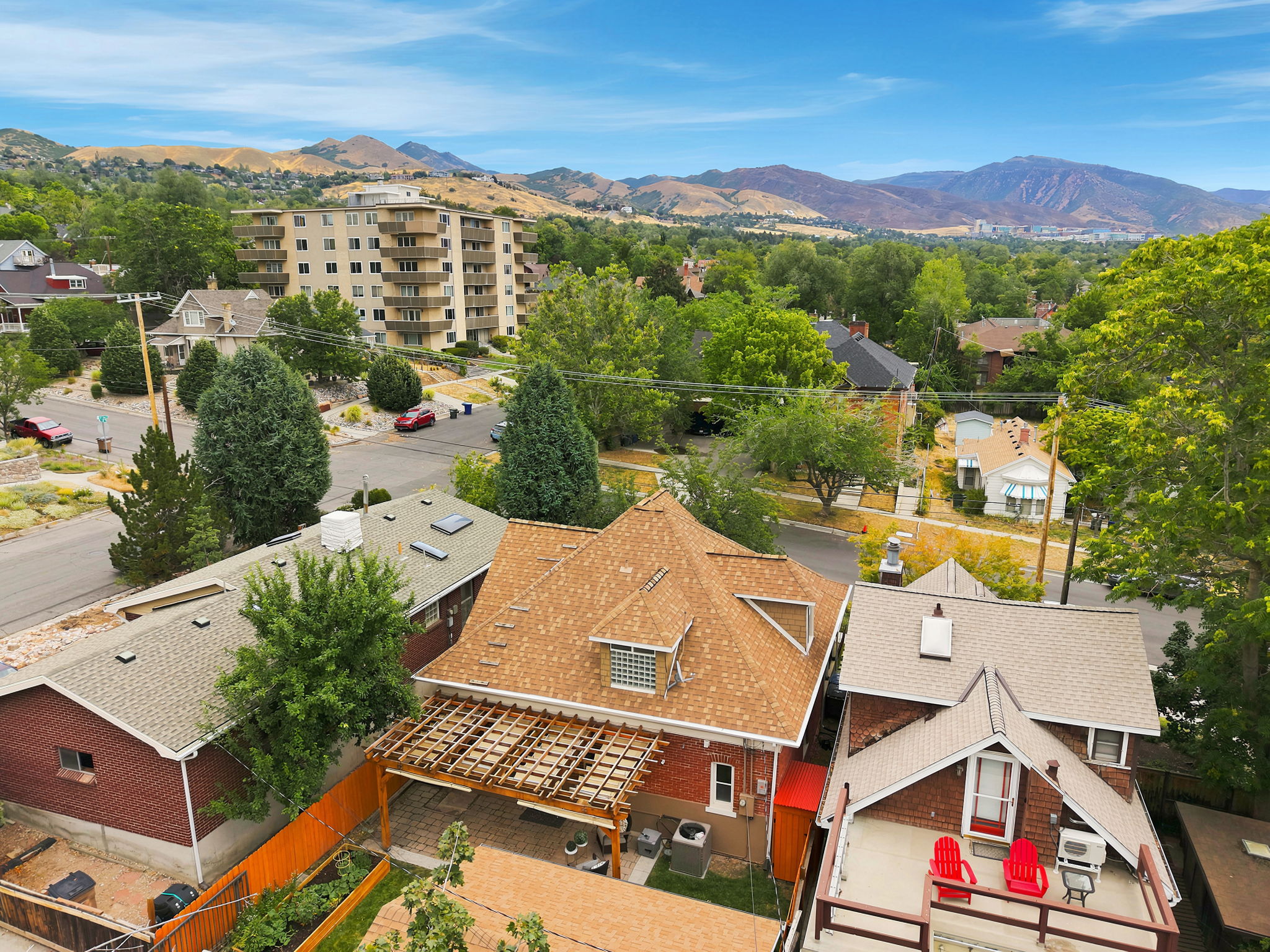 Aerial perspective showcasing a property with a distinct gabled roofline and dormer windows