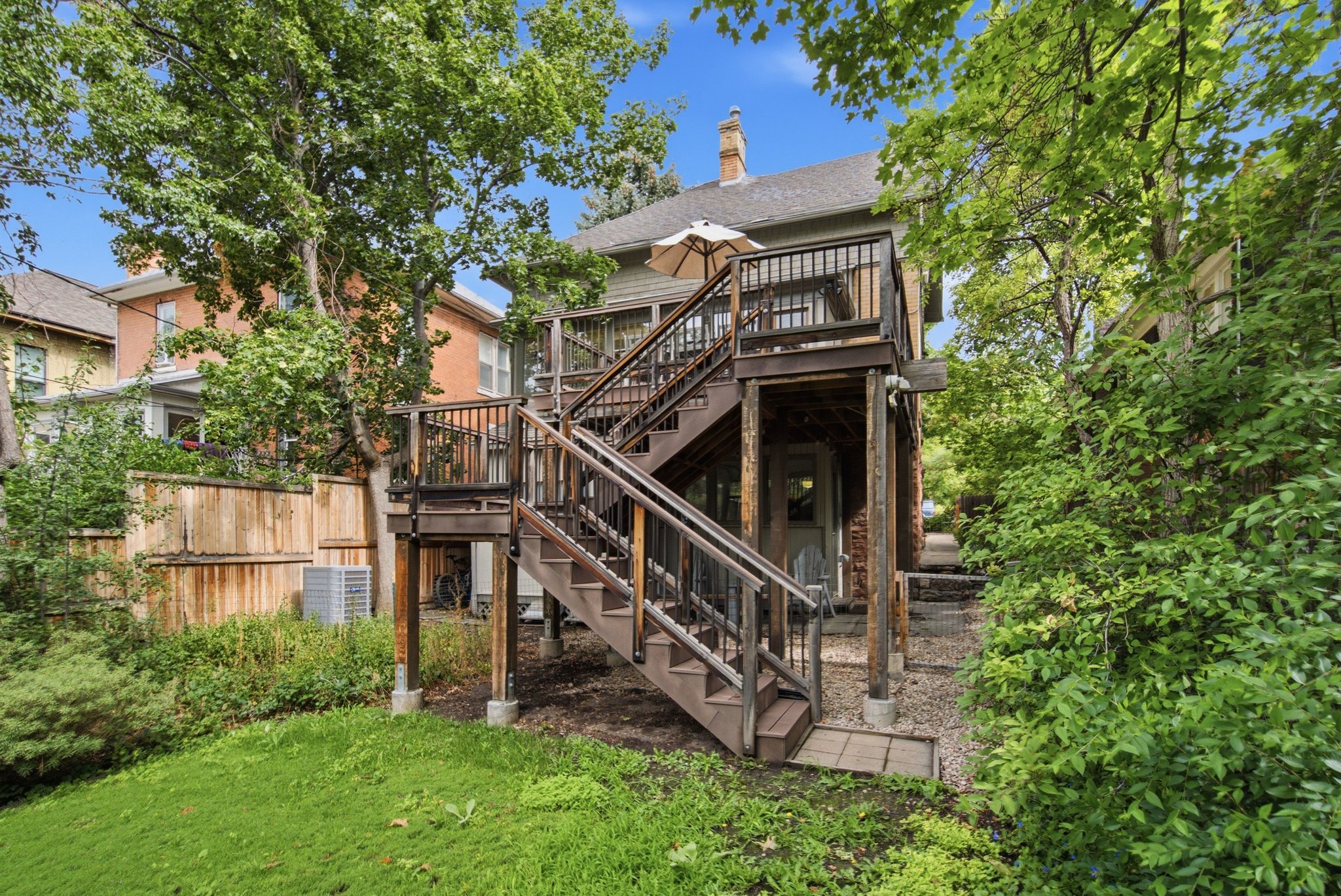 Multi-level wood deck and stairs providing access to the upper level