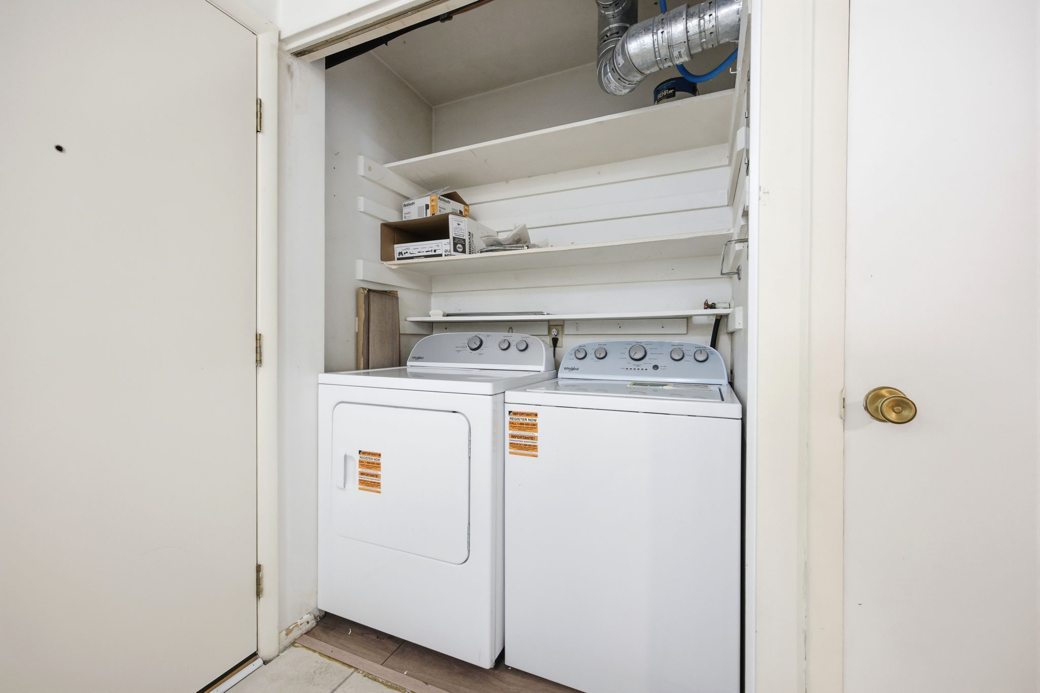 Dedicated laundry area with stacked shelving, providing organization and utility. Brand new washer and dryer.