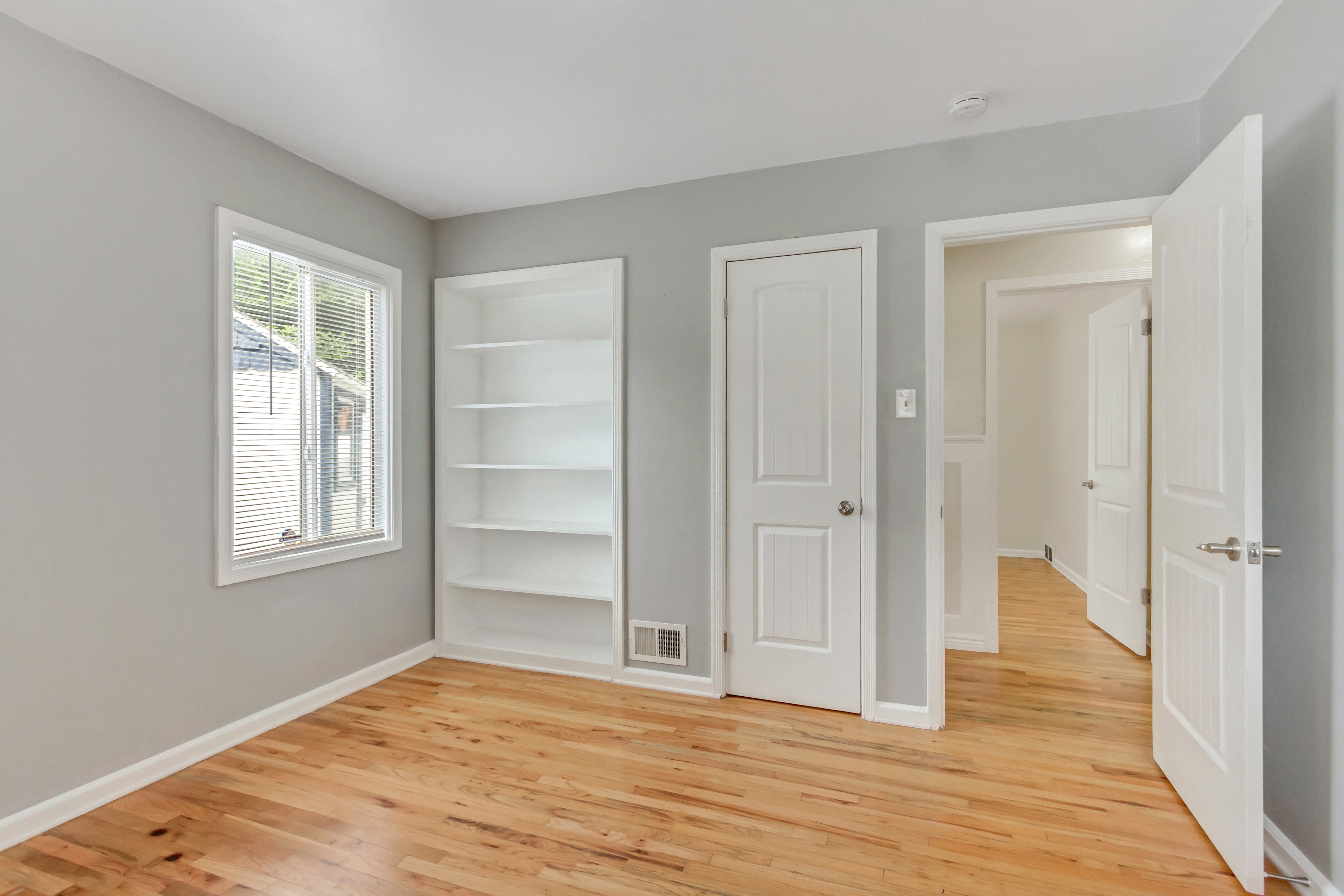 Light gray interior paint with wood-finish flooring