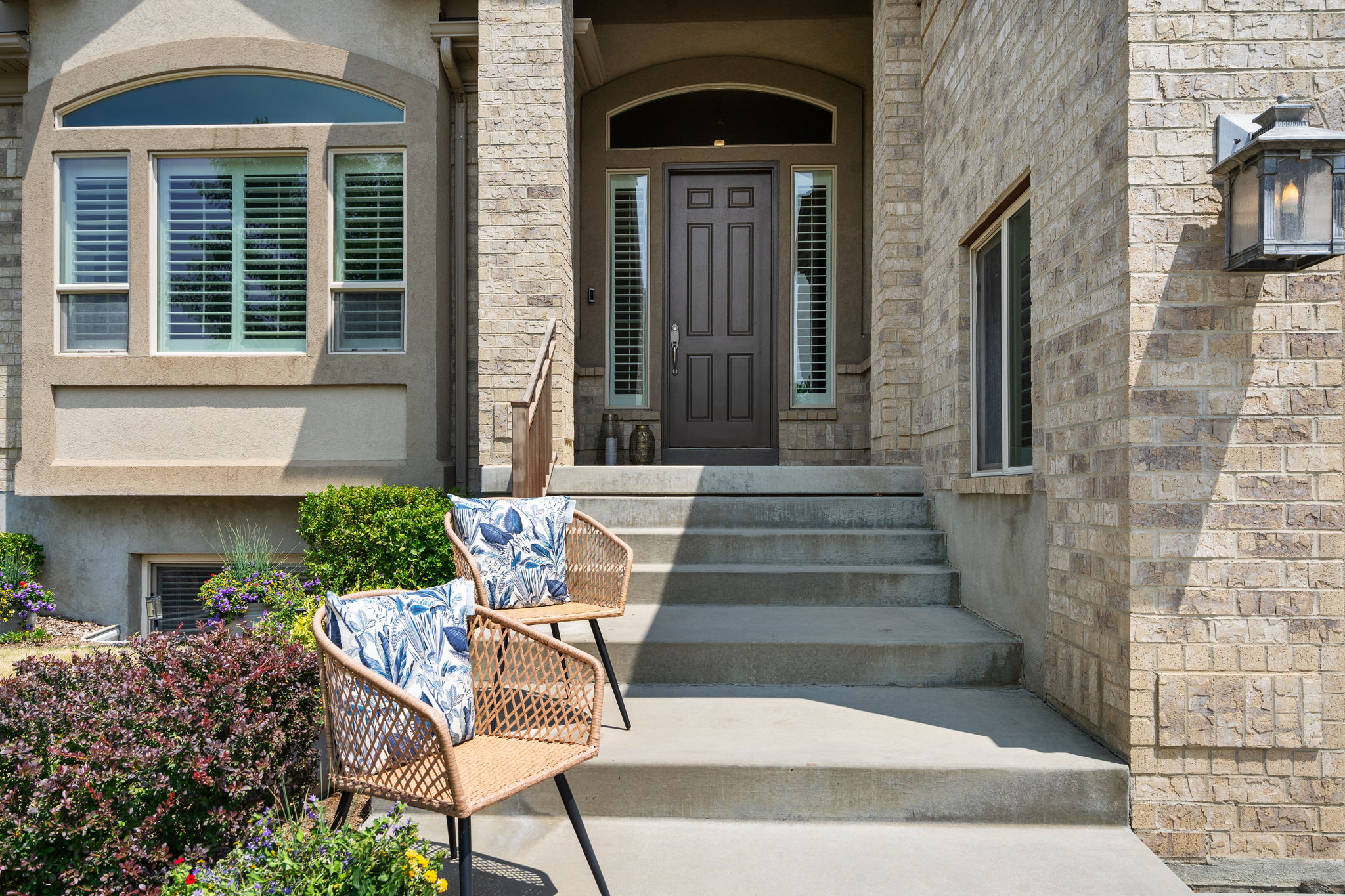 Distinguished entry with elegant architectural details makes arriving home special.
