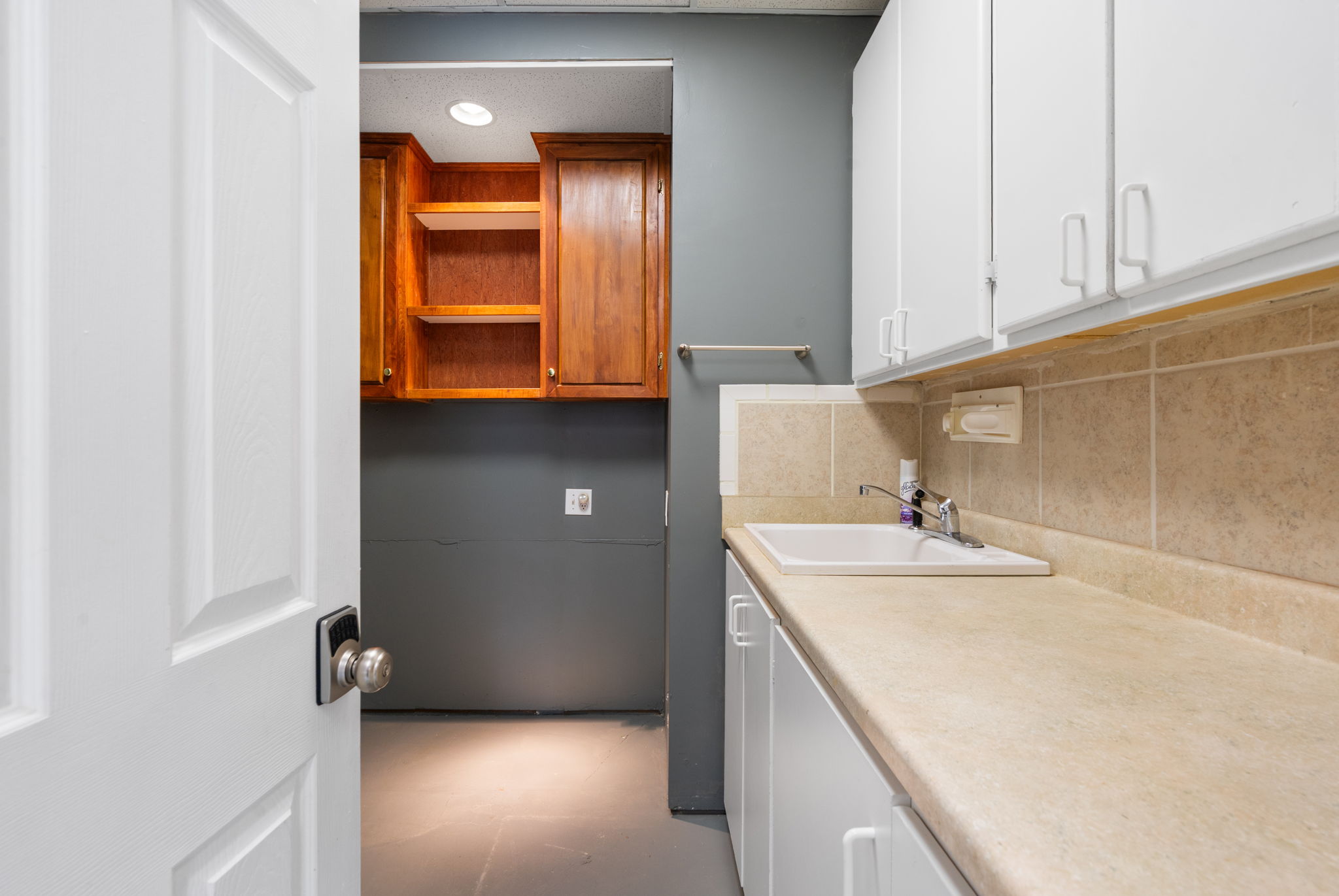 Located off current workshop is a functional utility room makes clean up easy.