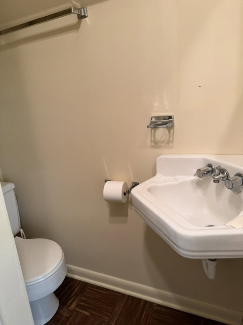 Wall-mounted porcelain sink with chrome fixtures