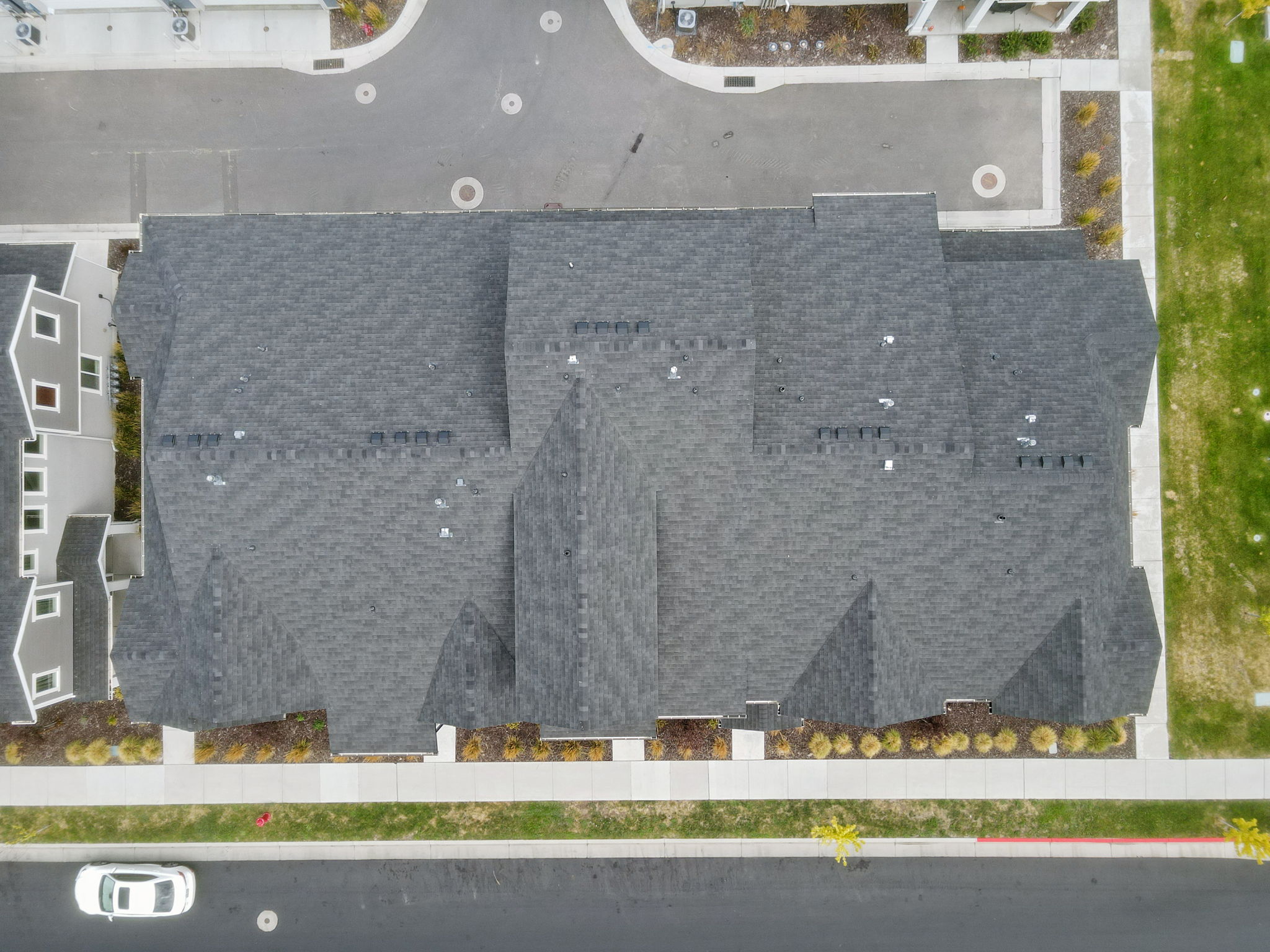Dark gray shingle roofing with multiple gables