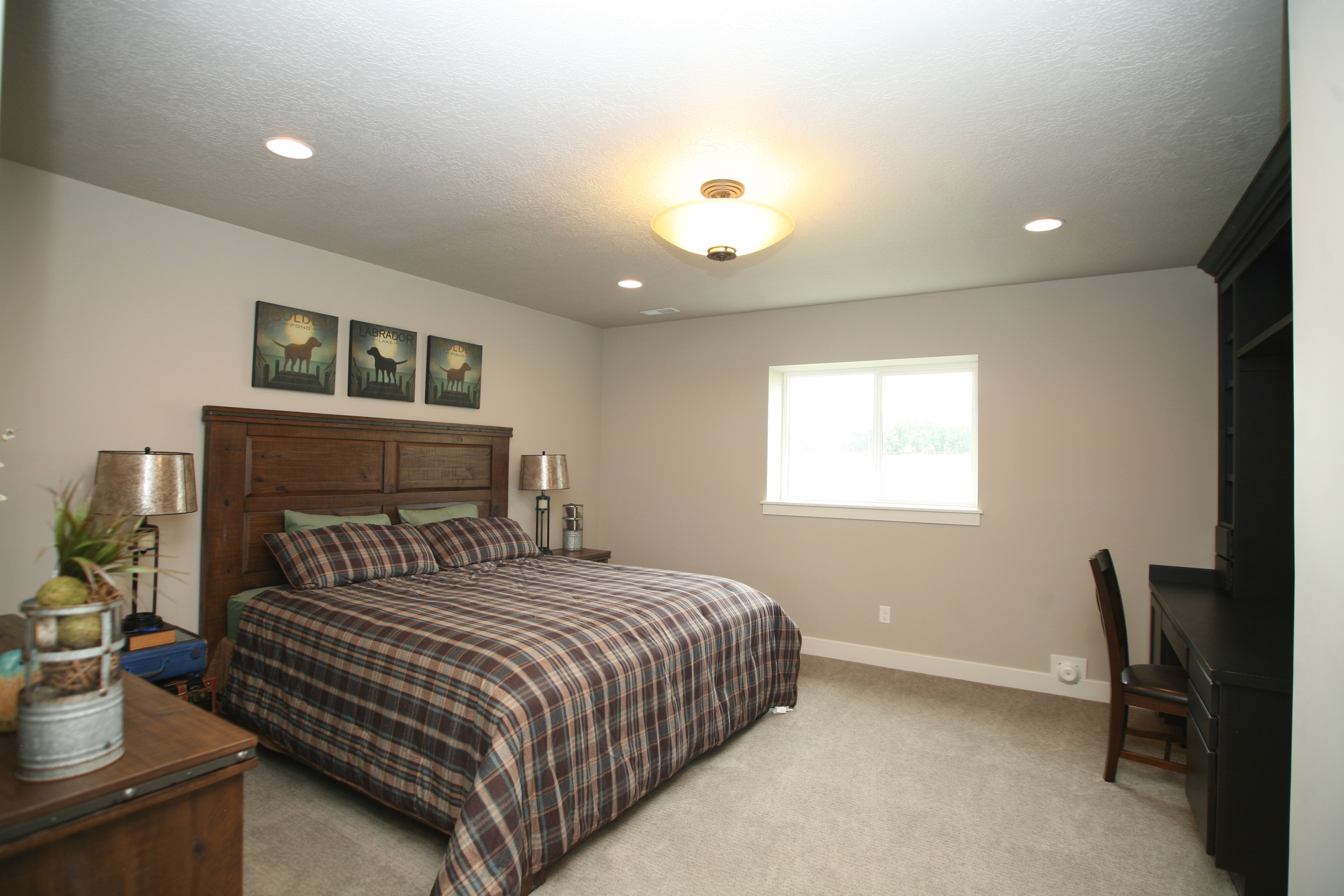 Oversized room featuring neutral carpeting and light-toned walls with room to spare.