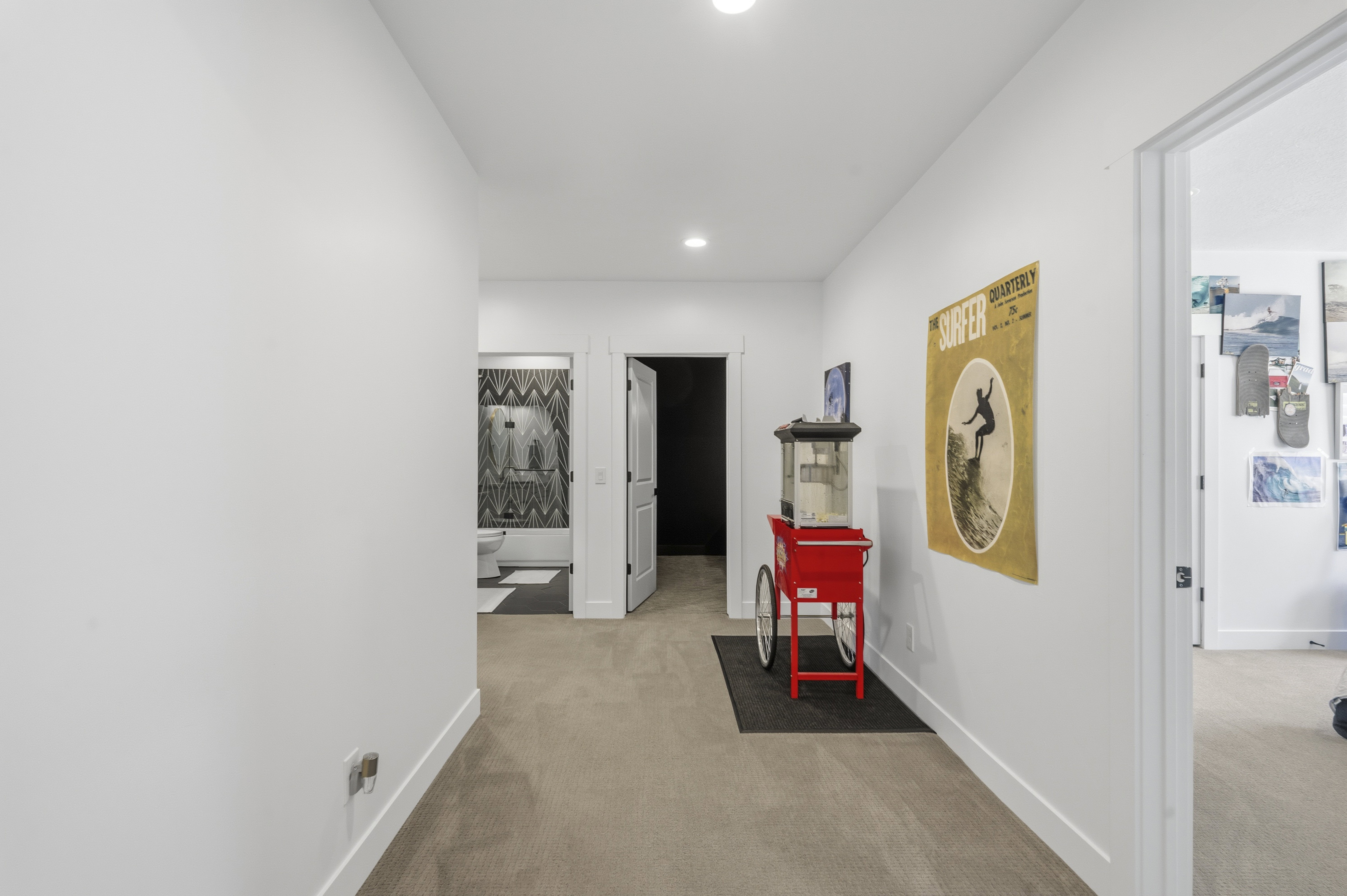 Interior hallway featuring recessed lighting, a neutral carpeted floor, and white baseboards